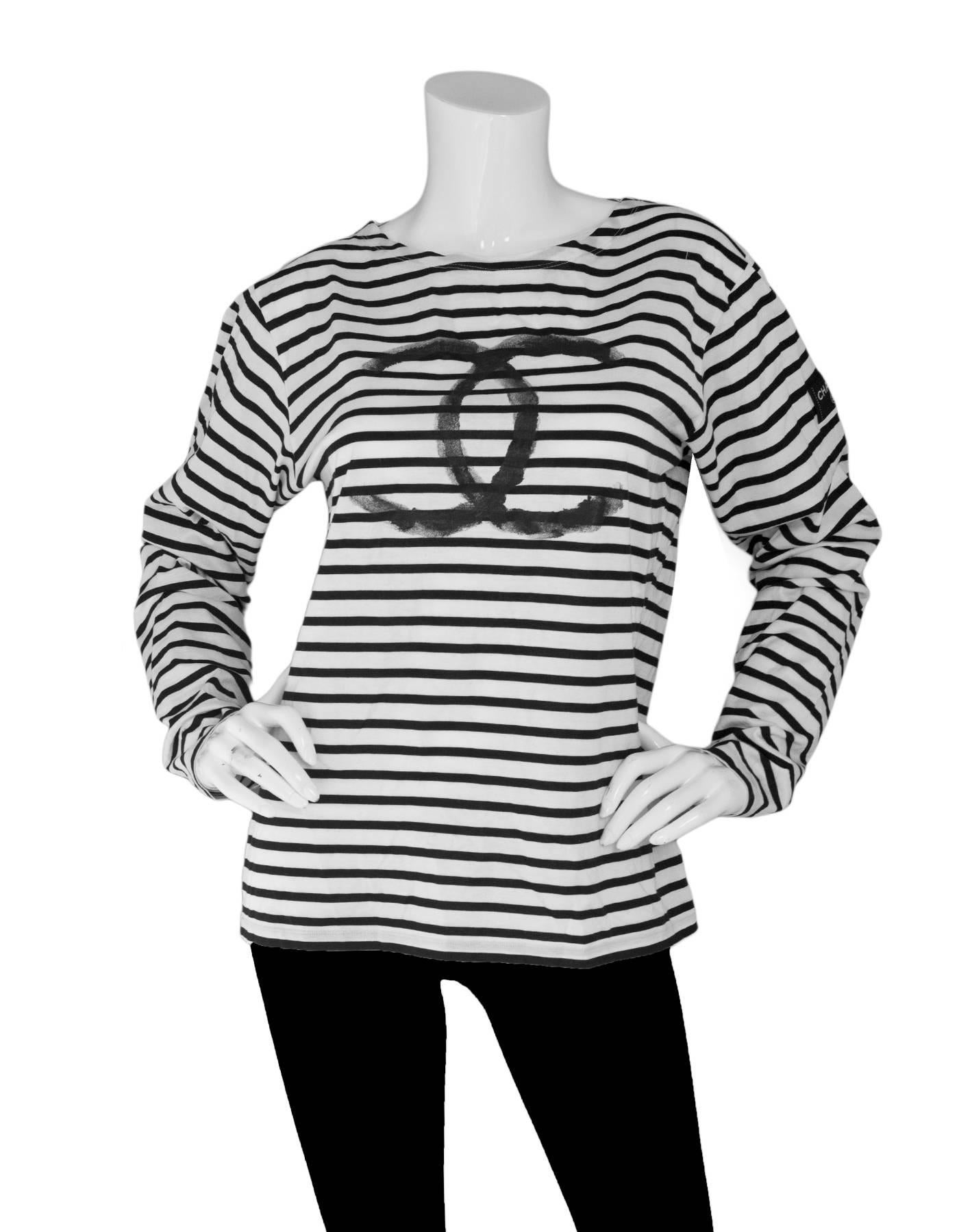 Chanel Black & White Stripe CC Uniform Top Sz L

Made In: Italy
Year of Production: 2008
Color: Black, white
Composition: 100% Cotton
Lining: None
Closure/Opening: Pull over 
Exterior Pockets: None
Interior Pockets: None
Overall Condition: Excellent