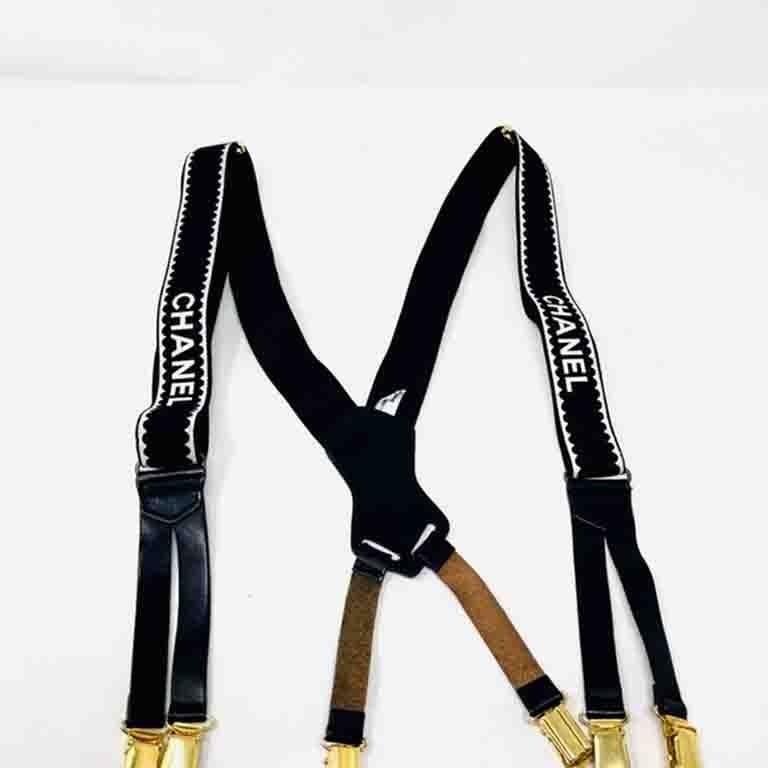 Rare and wonderful Chanel suspenders. A collectors and stylists dream!

Leather pieces. These have scratches on them from use and wear.
Adjustable Straps
The WHITE Chanel logo is in great condition with a hint of cracking.
Comes with original black