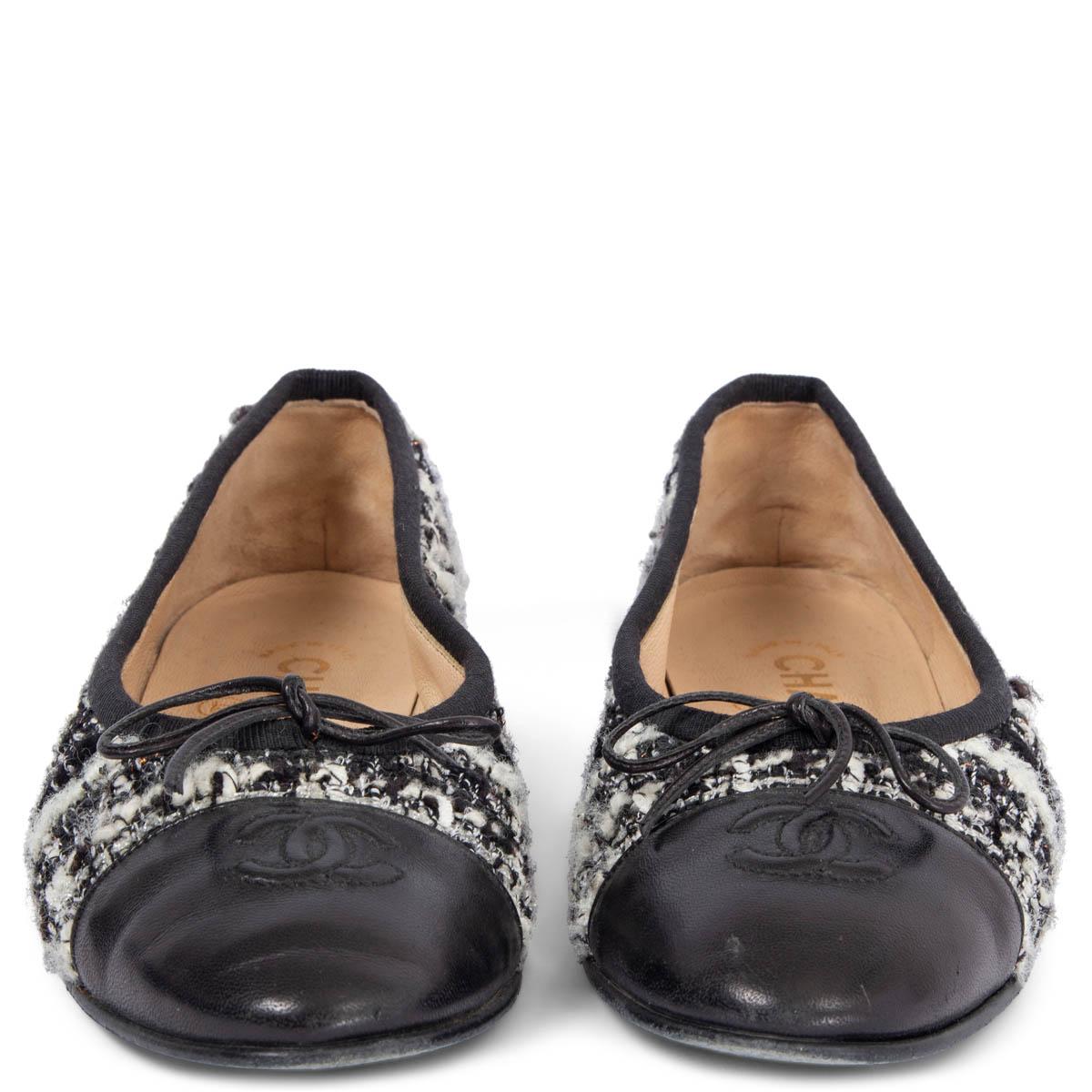 100% authentic Chanel ballerinas in black, white and light grey Bouclé tweed fabric with black smooth calf leather CC stitched tip. Have been worn and are in excellent condition. Come with dust bag. 

Measurements
Imprinted Size	36
Shoe