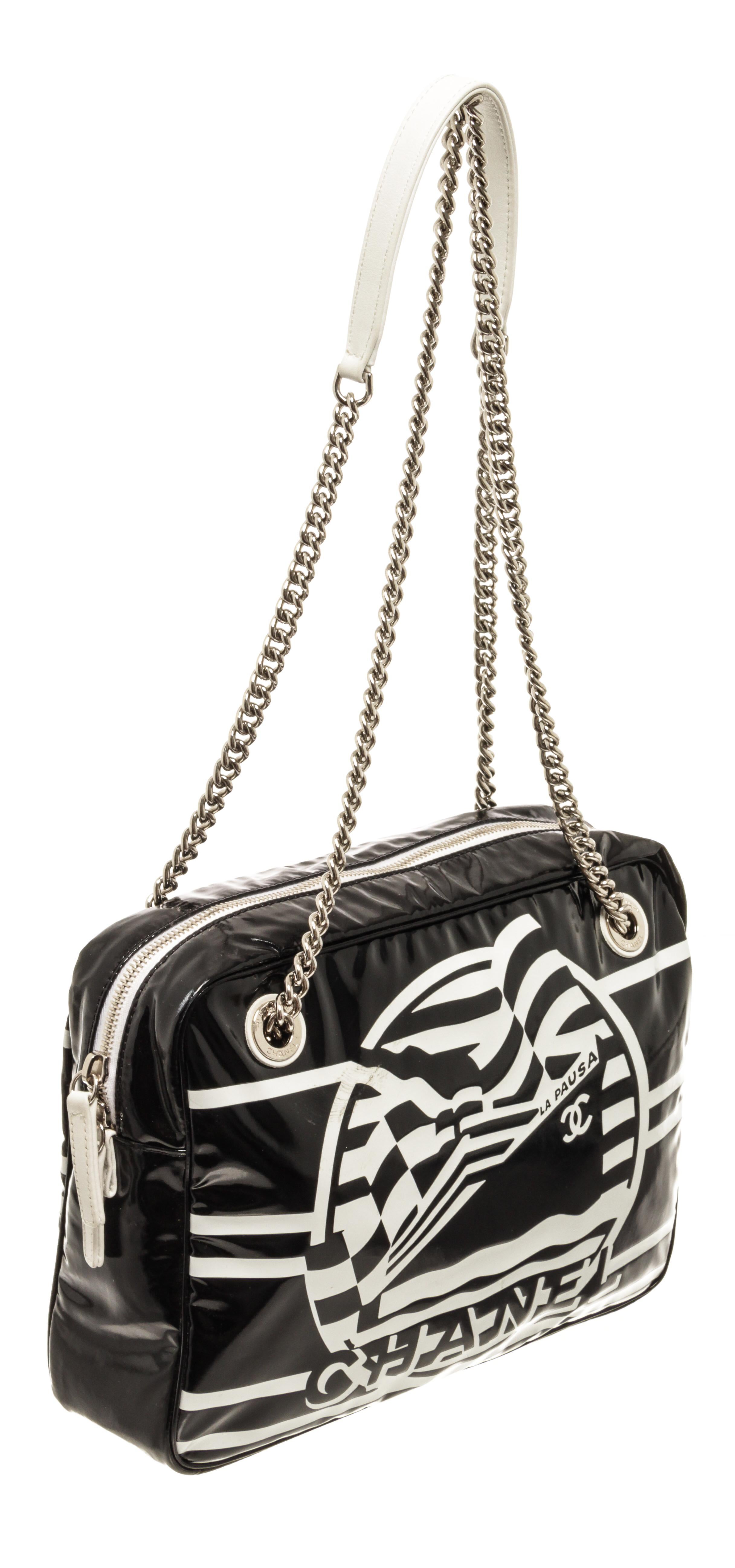 Chanel Black White Vinyl La Pausa Bay Bag with chain shoulder strap, fabric, silver hardware, zipper closure.

73930MSC