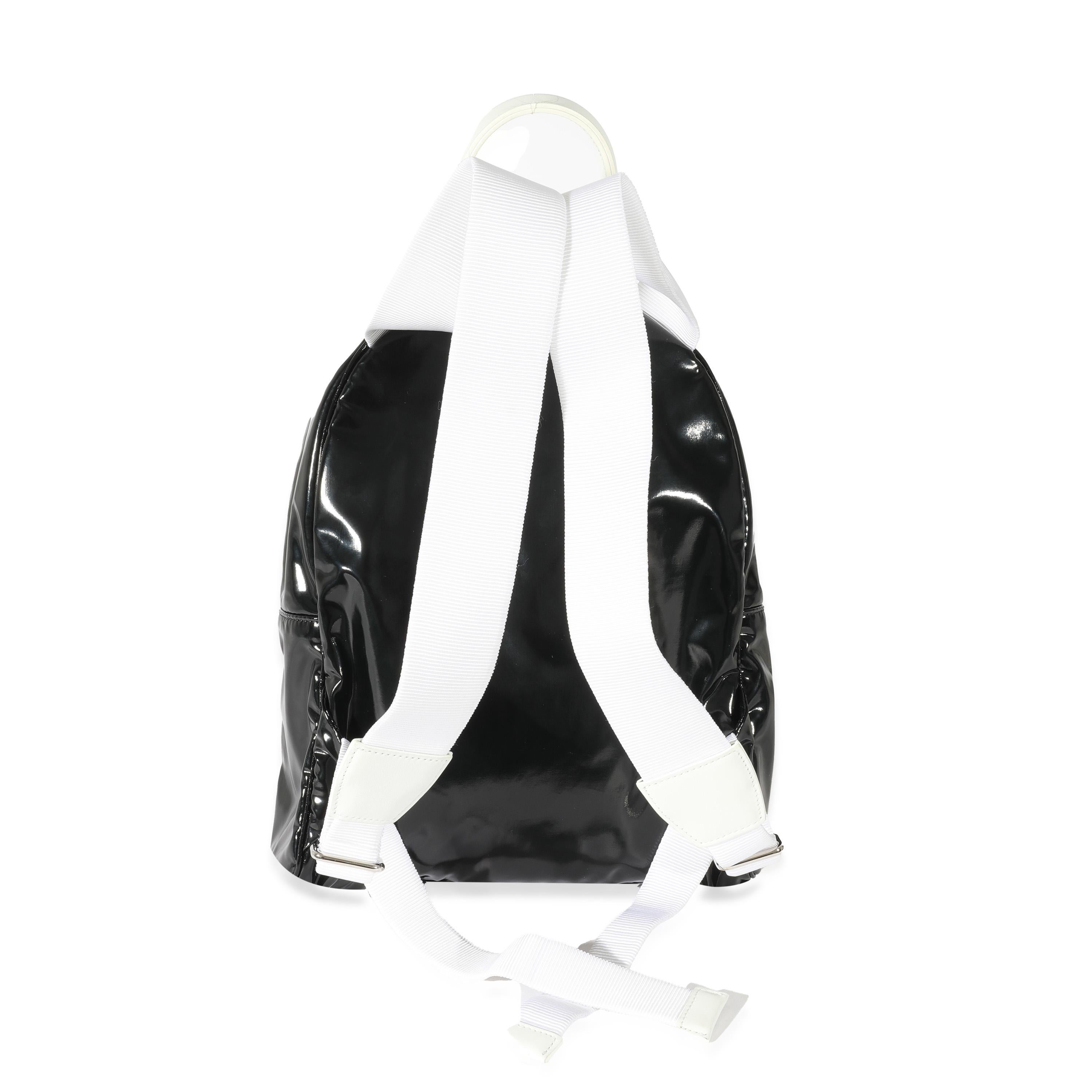 Listing Title: Chanel Black White Vinyl Small La Pausa Backpack
SKU: 129964
Condition: Pre-owned 
Handbag Condition: Excellent
Condition Comments: Item is in excellent condition and displays light signs of wear. Exterior and interior faint scuffing.