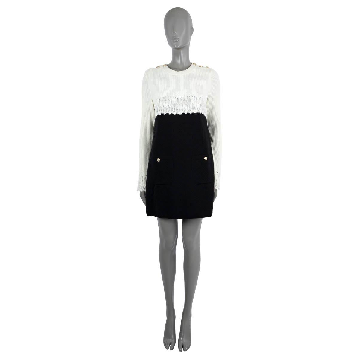 100% authentic Chanel colorblock knit dress with a top in ivory rib-knit viscose (60%) and polyamide (40%) and a skirt in black quilted wool (94%), polyamide (5%) and elastane (1%). Features gold-buttons on the shoulders, two buttoned patch pockets
