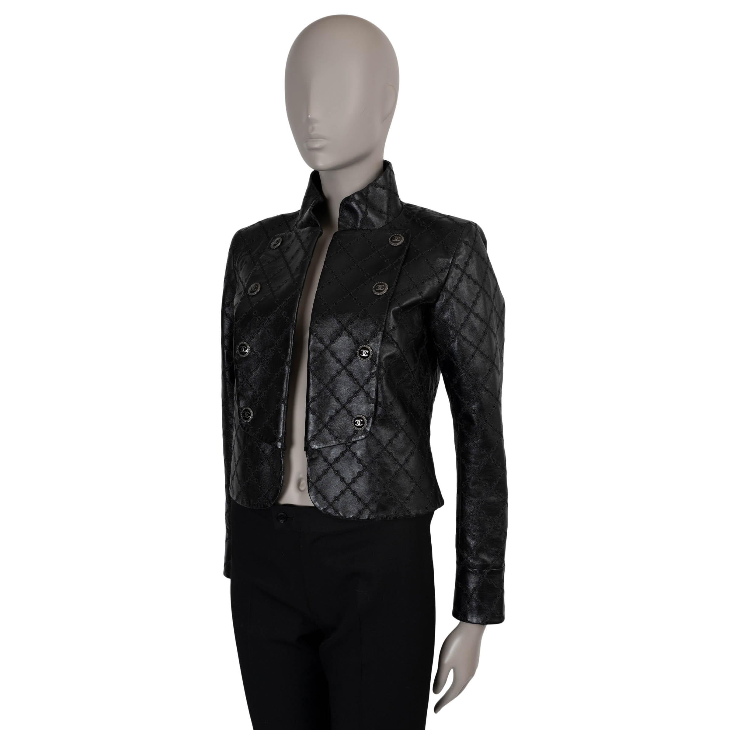 This 100% authentic Chanel military jacket in black lambskin leather combines edgy sophistication with signature craftsmanship. Featuring intricate pointelle embroidery in a diamond quilt pattern, it boasts an open, cropped silhouette with a high