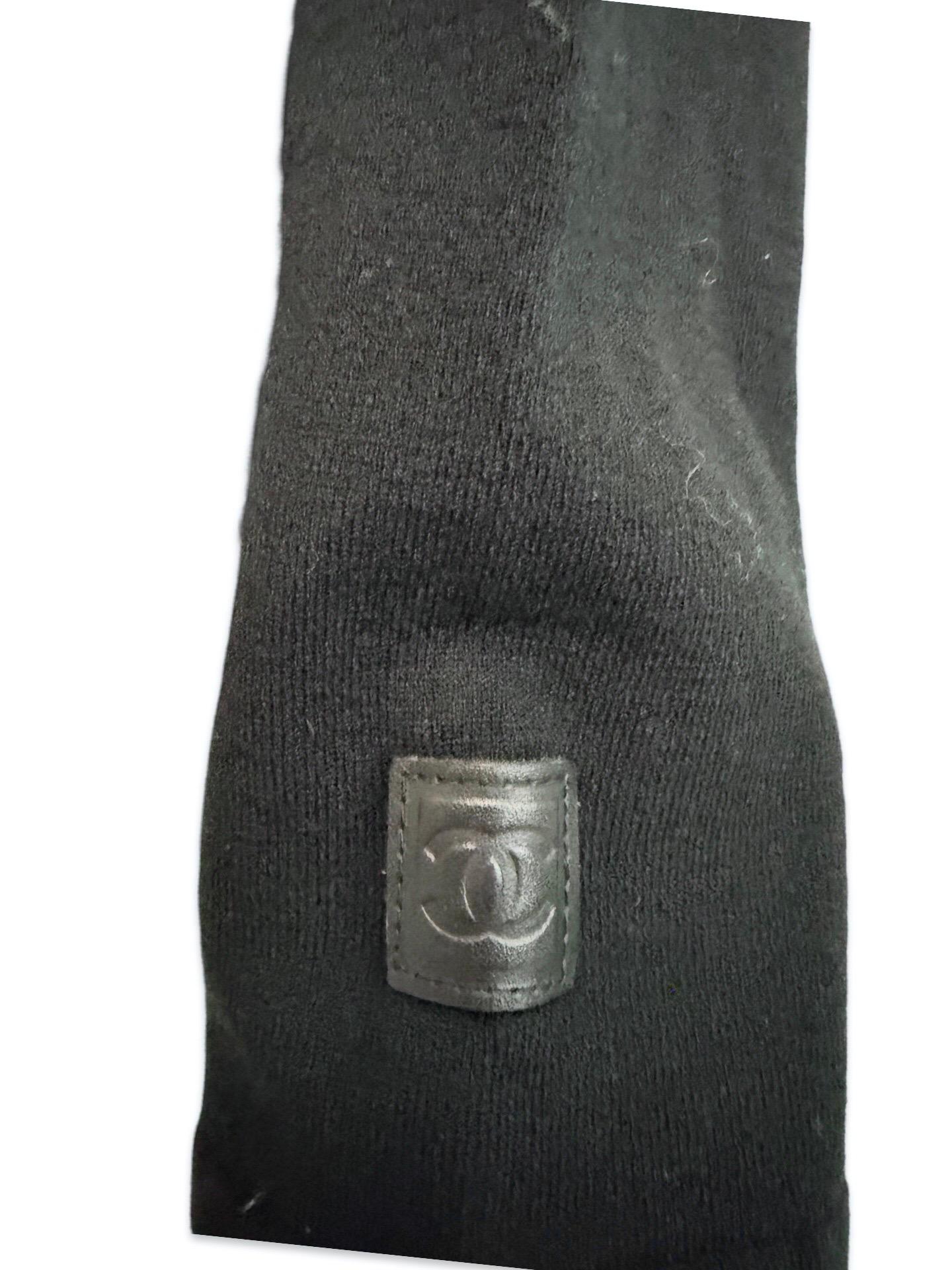 - Chanel black wool hoodie zip sweater from Fall 2004 collection.

- Featuring yellow drawstring throughout .

- black 