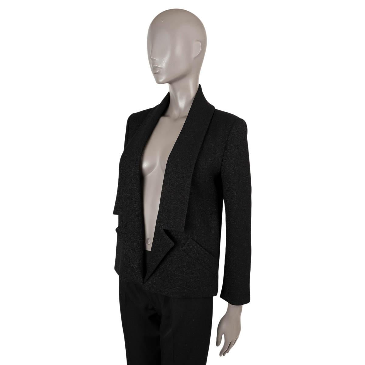 100% authentic Chanel shawl collar open lurex jacket in black wool (97%) and polyamide (3%). The design features three buttons on each cuff and two slit front pockets. Lined in black silk (100%). Has been worn and is in excellent condition. 

2014