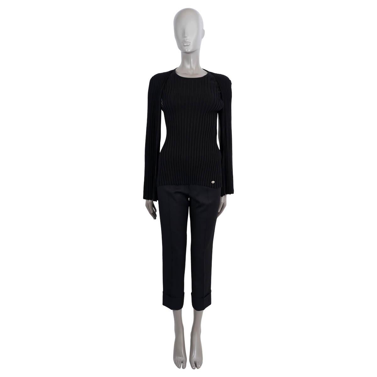 100% authentic Chanel rib-knit sweater in black wool (100%). Features a round neck, long cape sleeves and antique silver-tone coin button at the waist. Brand new with tags. 

2016 Paris-Rome Metiers d'Art

Measurements
Model	16A P54458 K07085 
Tag
