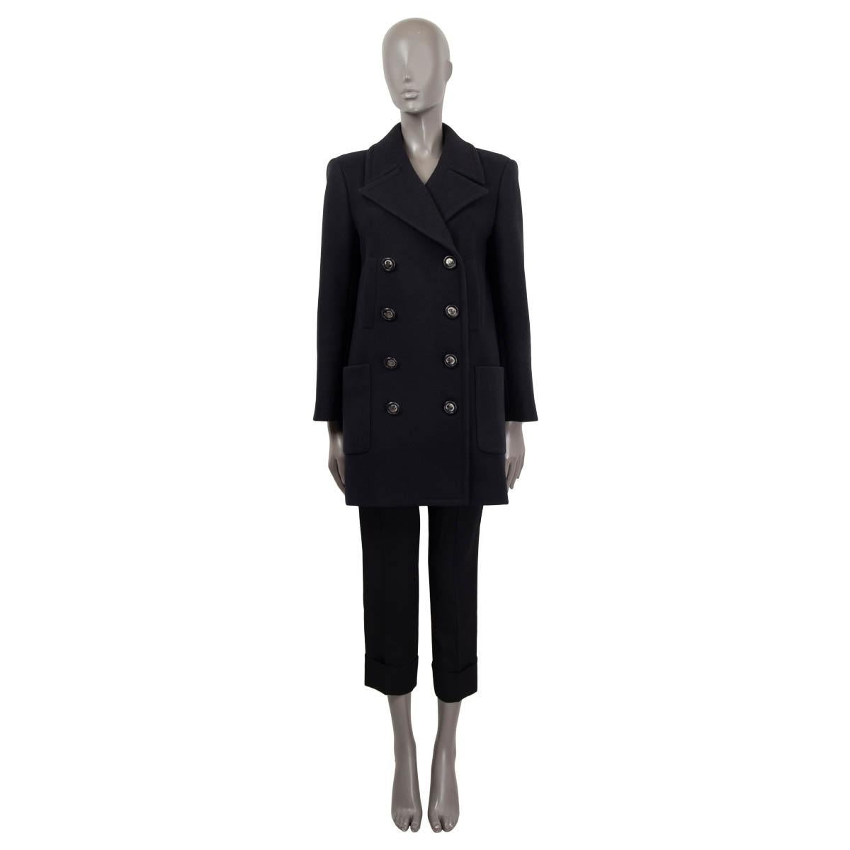 100% authentic Chanel 2017 double breasted short peacoat in black wool (100%). Features two patch pockets and two slit pockets on the front. Opens with 'CC' buttons on the front. Lined in black silk (100%). Has been worn and is in excellent