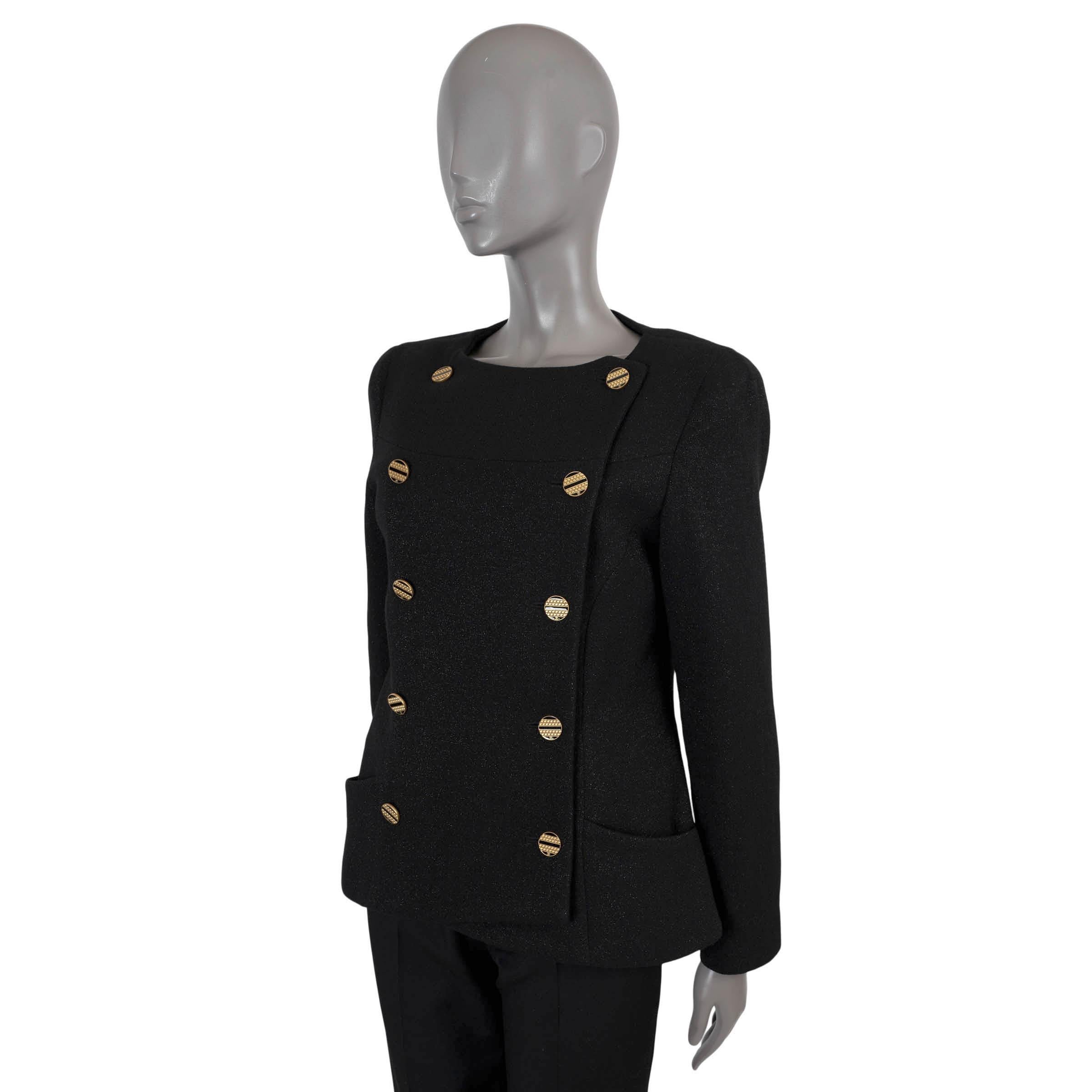 100% authentic Chanel double-breasted tweed jacket in black wool (with 2% polyamide). Features a tailored silhouette with a round neck and two pockets at the waist. Closes with a double row of rhinestone embellished gold-tone metal and black enamel