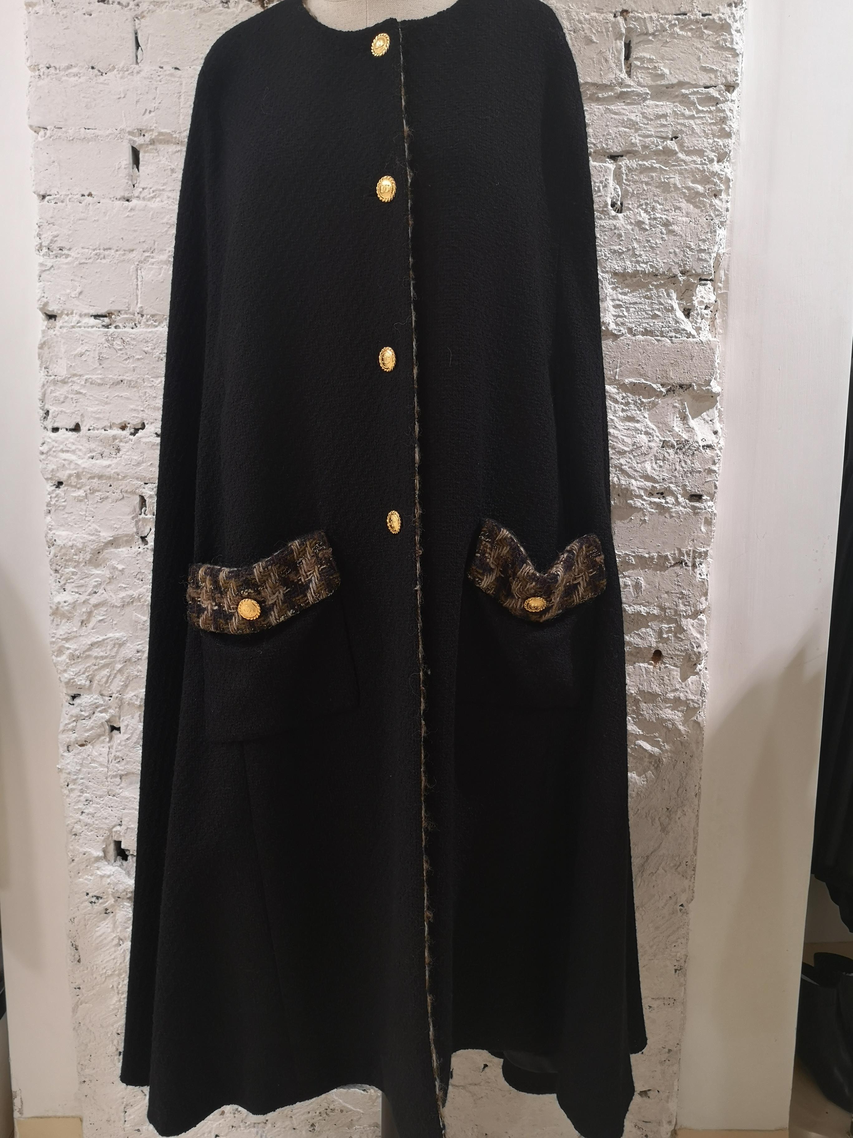 Chanel black wool and silk cape
A really vintage piece created bu Chanel boutique for Garkinckel's 
total lenght is 110 cm
embellished with gold tone CC logo bottons 
size marked 42