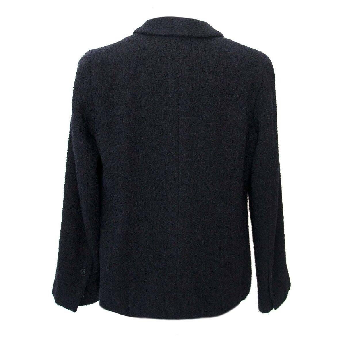 Good preloved condition

Chanel Black Wool Blazer - Size 42

This beautiful black wool blazer with black Chanel buttons details is one chic item.
The iconic Chanel wool makes this blazer a need in every fashionista's closet.
As this blazer features