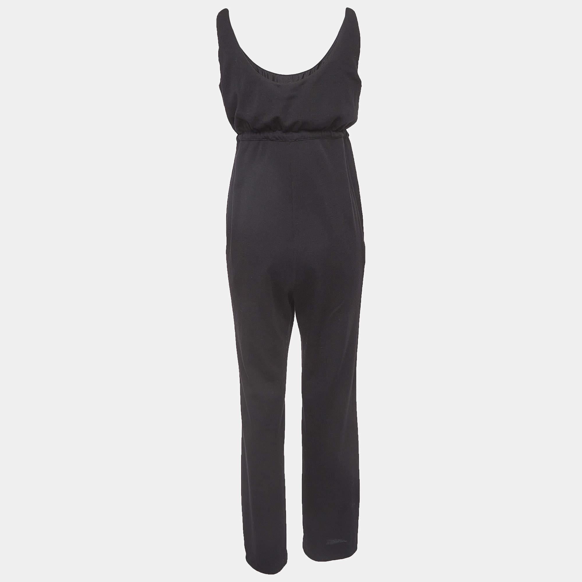 Bring in a touch of sophistication and elegance to your look by wearing this Chanel jumpsuit. A flattering neckline, classy hue, and noticeable details define this jumpsuit. Style it with high heels.

