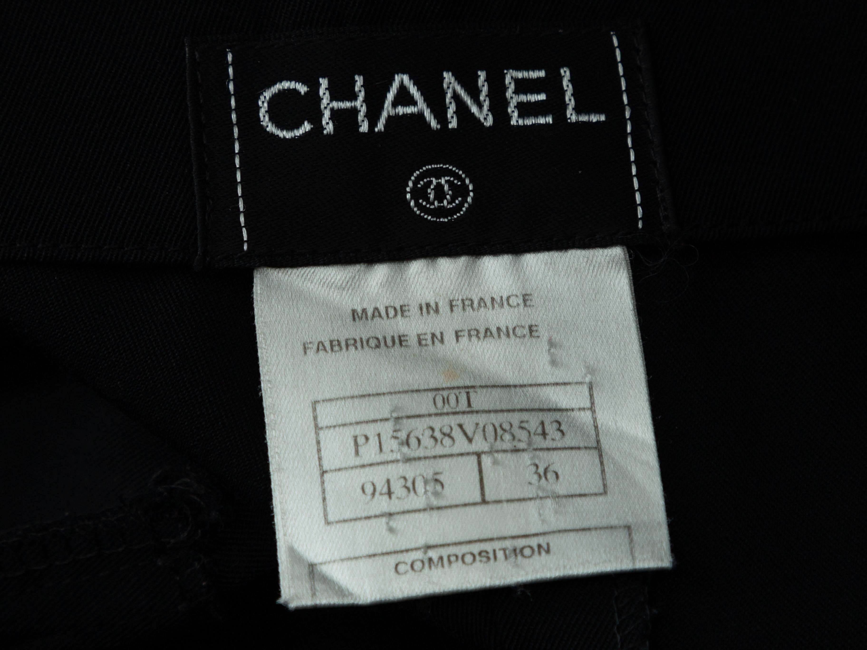 Product details: Black wool straight-leg pants by Chanel. Zip closure at side. Designer size 36. 25