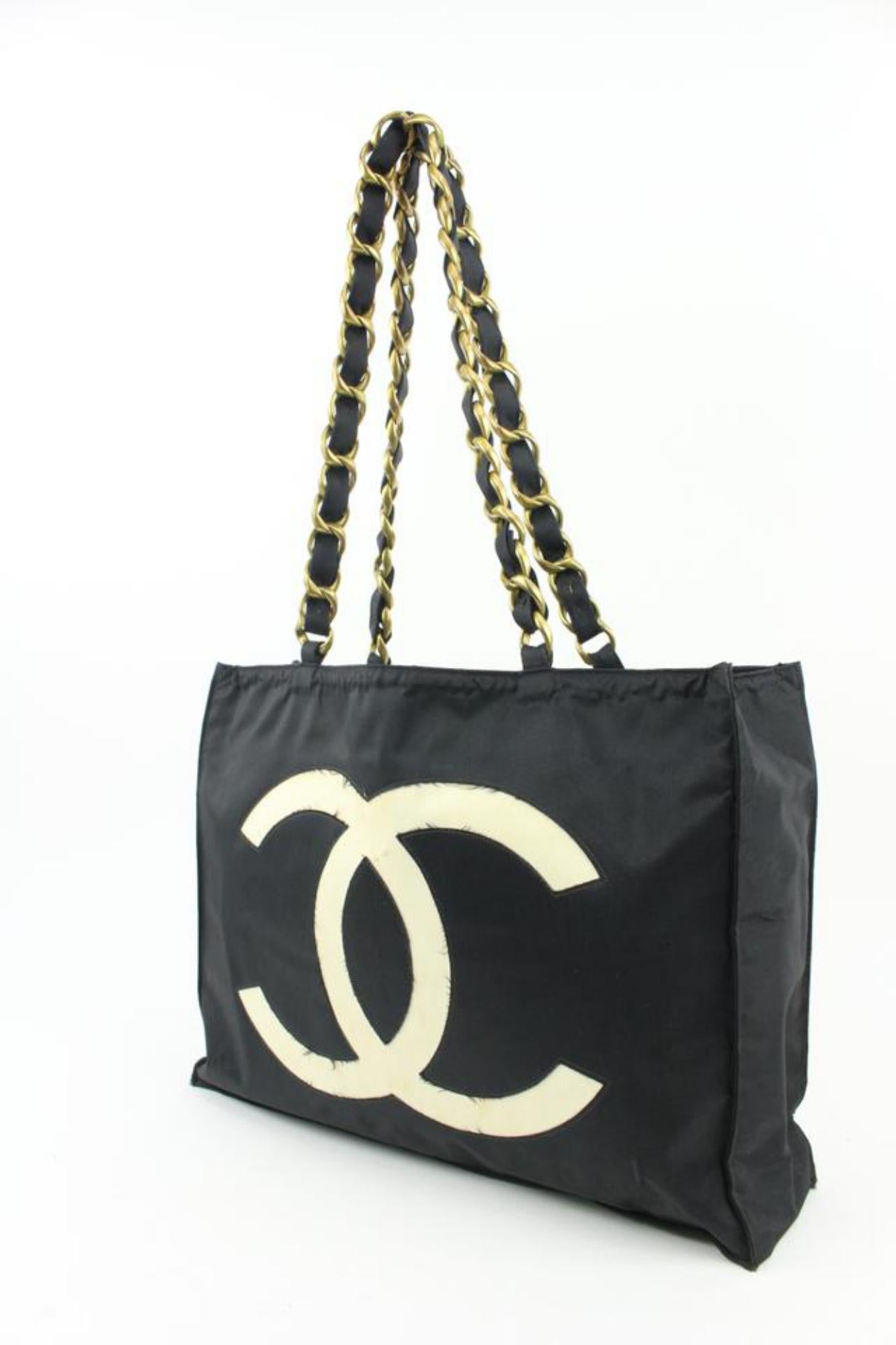 Chanel Black x White x Gold CC Logo Jumbo Shopper Tote 114ca6
Date Code/Serial Number: Rubbed Off
Made In: France
Measurements: Length:  16