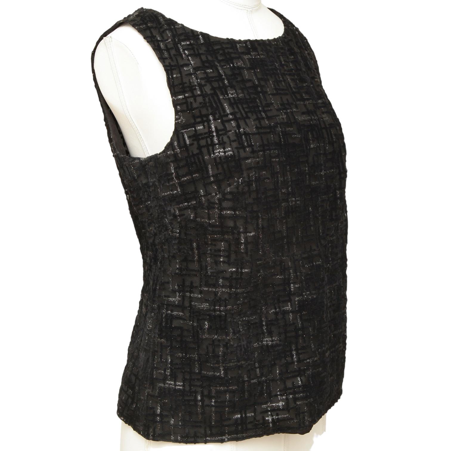 GUARANTEED AUTHENTIC CHANEL SPRING 2012 BLACK SLEEVELESS PATTERNED TOP

Retail excluding sales taxes $2,190

Design:
• Black sleeveless blouse.
• Mesh/glitter pattern.
• Scoop neck.
• CC button closure at back of neck.
• Lined.
   
Size: