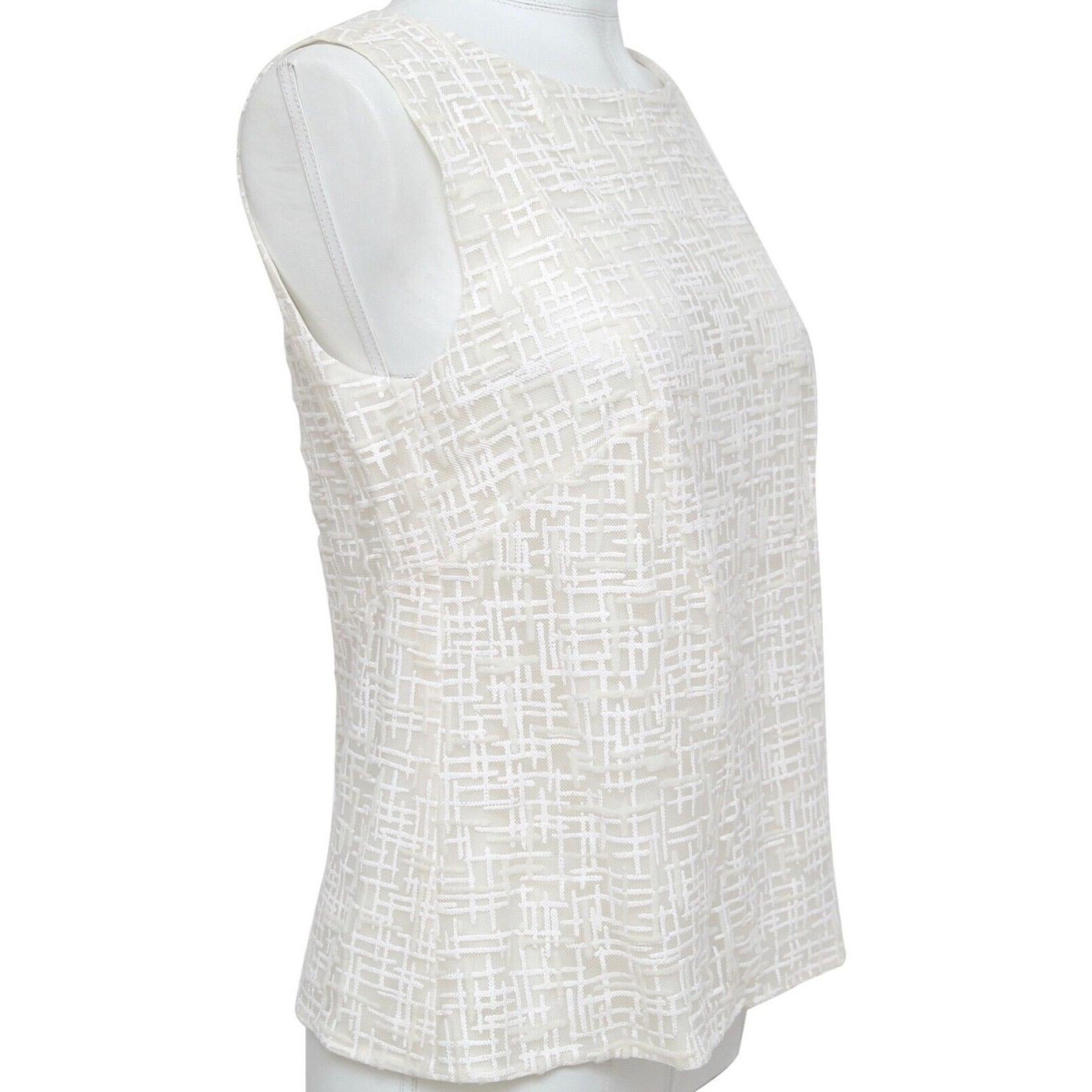 GUARANTEED AUTHENTIC CHANEL SPRING 2012 IVORY SLEEVELESS PATTERNED TOP


Design:
o Ivory sleeveless blouse.
o Mesh/glitter pattern.
o Scoop neck.
o Faux Pearl CC button closure at back of neck.
o Lined.

Size: 40

Material: 67% Rayon, 22% Polyester,