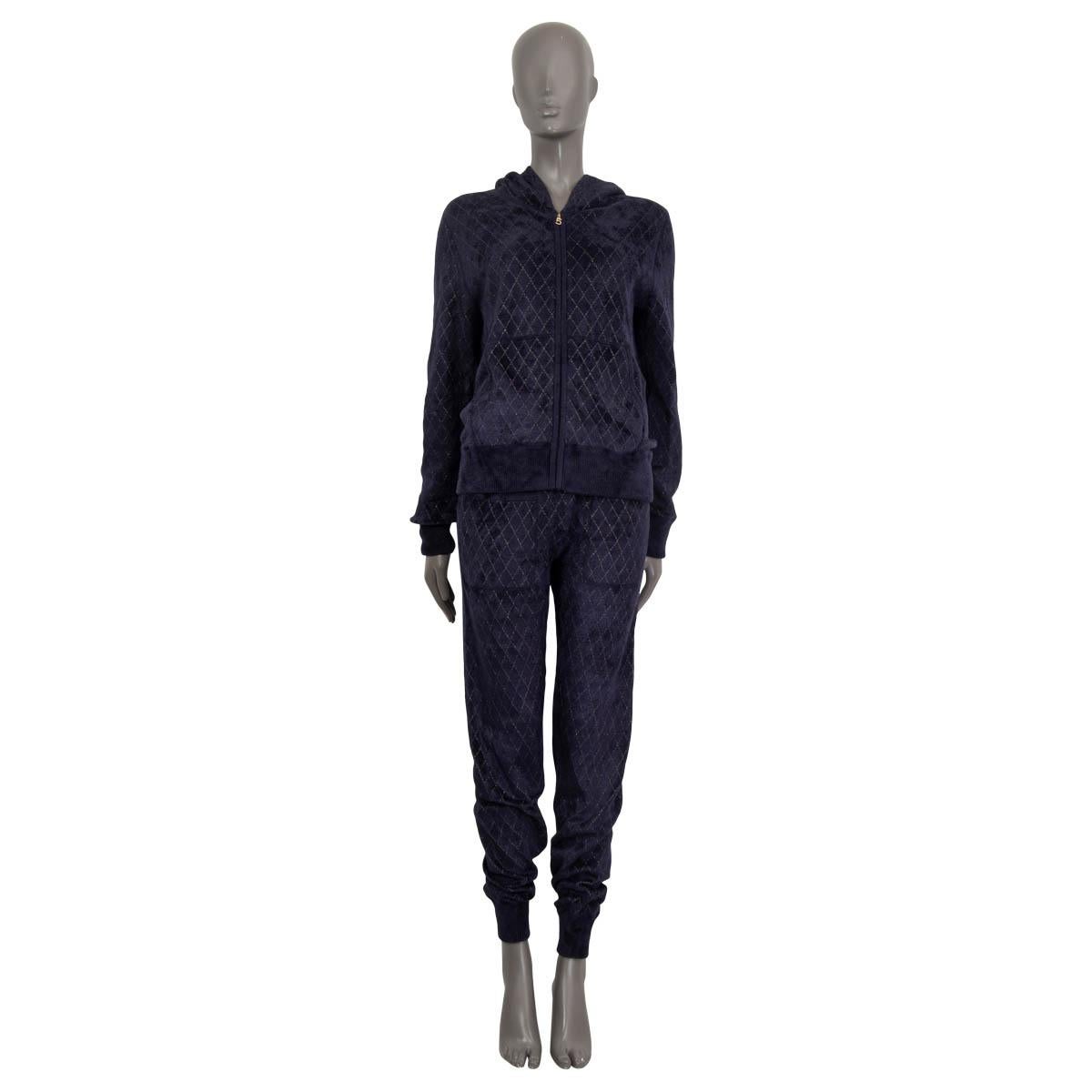 100% authentic Chanel Pre-Fall 2019 hooded zipper cardigan in midnight blue and gold viscose (66%), polyamide (33%) and polyester (1%). Features two slit pockets on the front. Opens with a No. '5' zipper on the front. Unlined. Has been worn and is