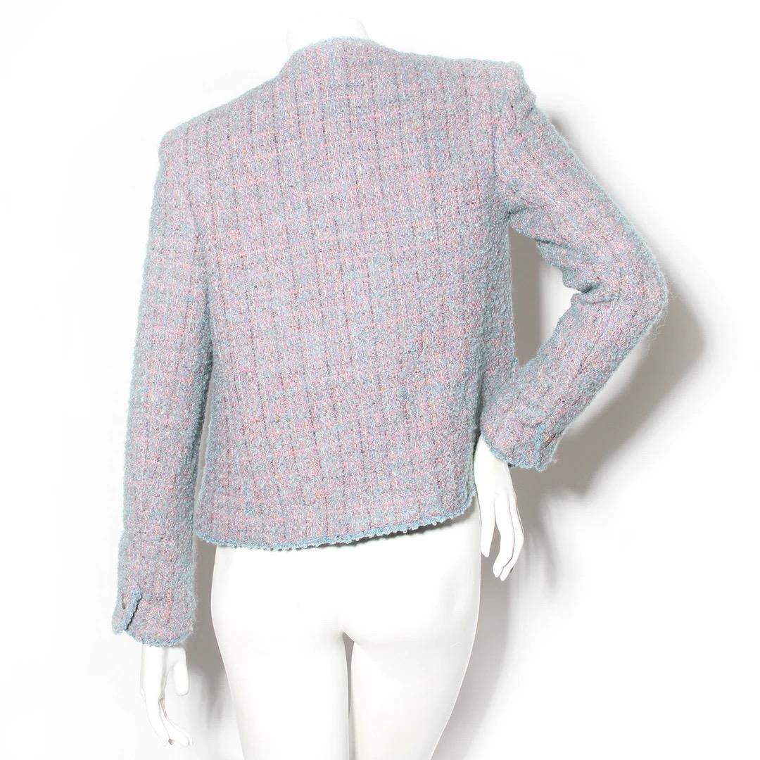 Chanel Classic Jacket
Made in France 
Fall / Winter Ready to Wear 1997 collection
Baby blue and light pink tweed 
Four pockets on front of jacket 
Each pocket has a bronze round button stamped with an interlocked CC pattern and Chanel Paris