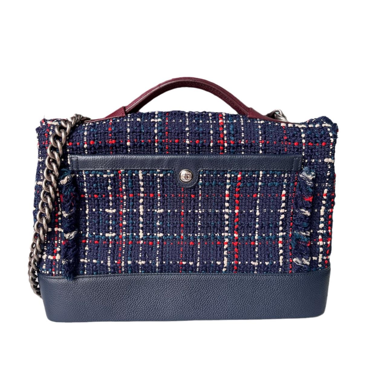 The Chanel Blue and Red Tweed and Caviar Airline Flap Bag Silver Hardware 2016 is a classic and stylish statement piece. With tweed and grained calfskin leather, the bag is lined with tonal fabric and features antiqued silver hardware. It has added