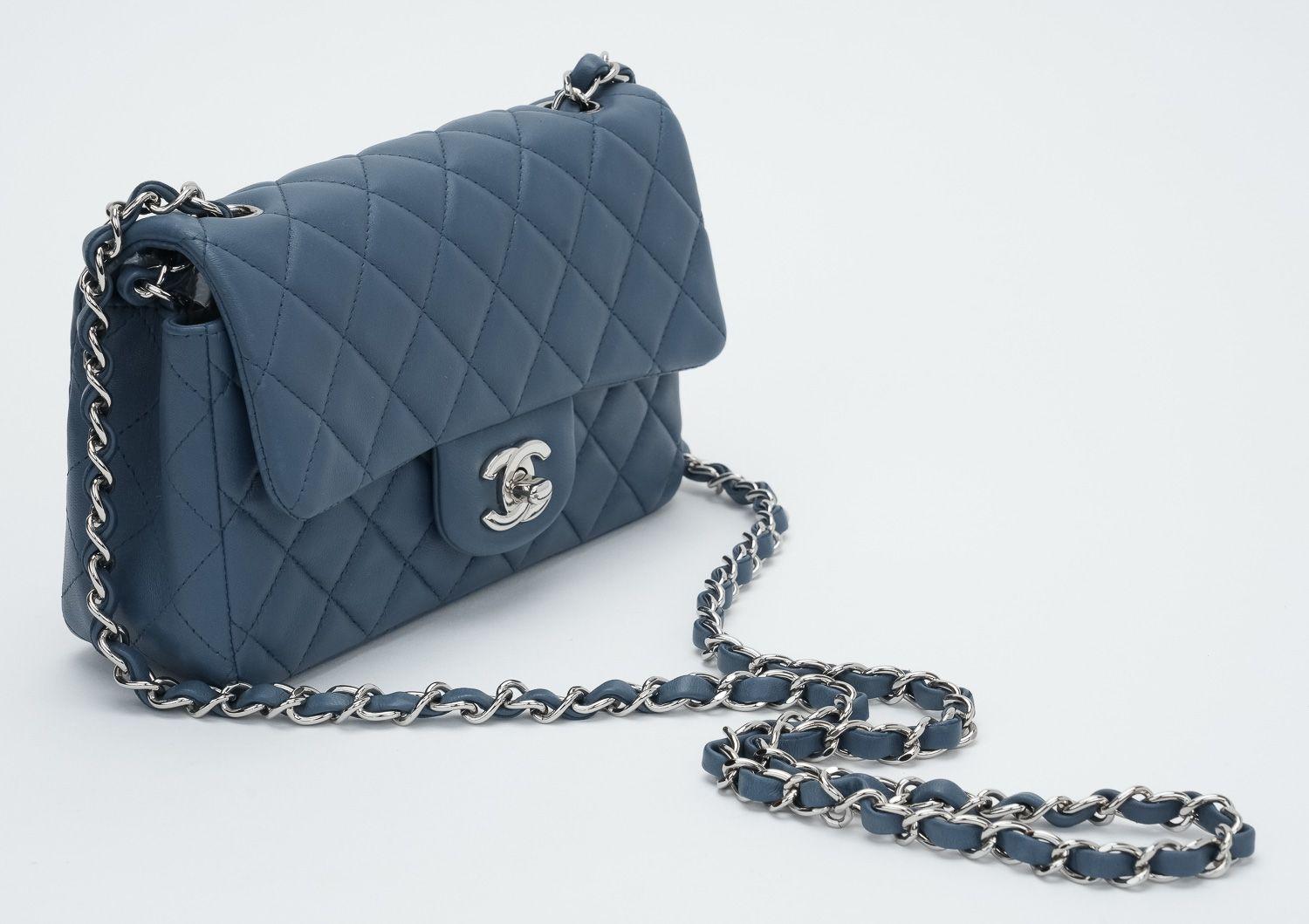 Chanel Mini Rectangular Classic flap bag. Crafted in luxurious Blue Jeans Lambskin leather with silver hardware. Cross body chain. Collection 16. Excellent condition. The bag shows the hologram and comes with the id card and original dust cover .