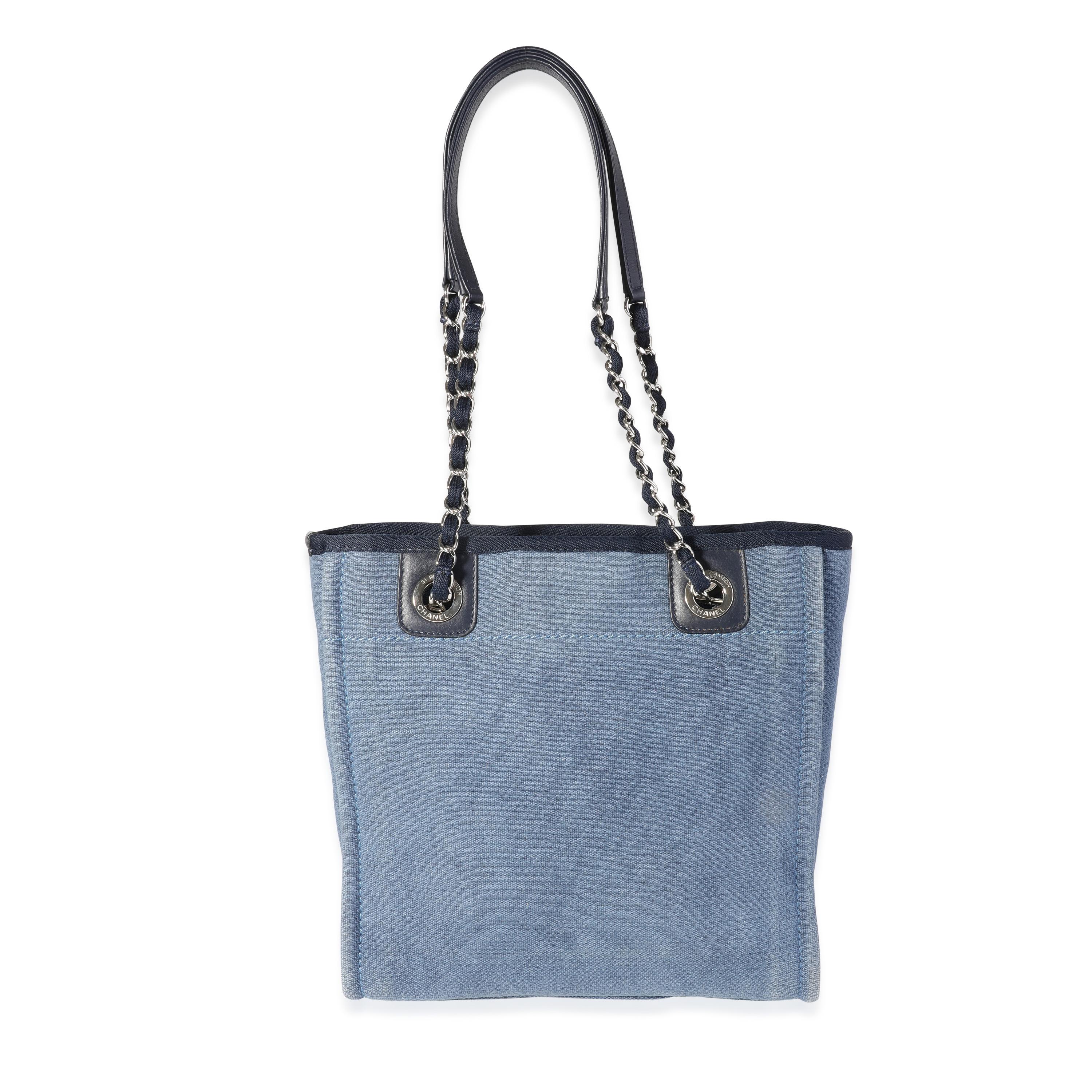 Listing Title: Chanel Blue Canvas & Calfskin Mini Deauville Tote
SKU: 118589
Condition: Pre-owned (3000)
Handbag Condition: Very Good
Condition Comments: Very Good Condition. Discoloration throughout exterior. Scratching to hardware. Discoloration