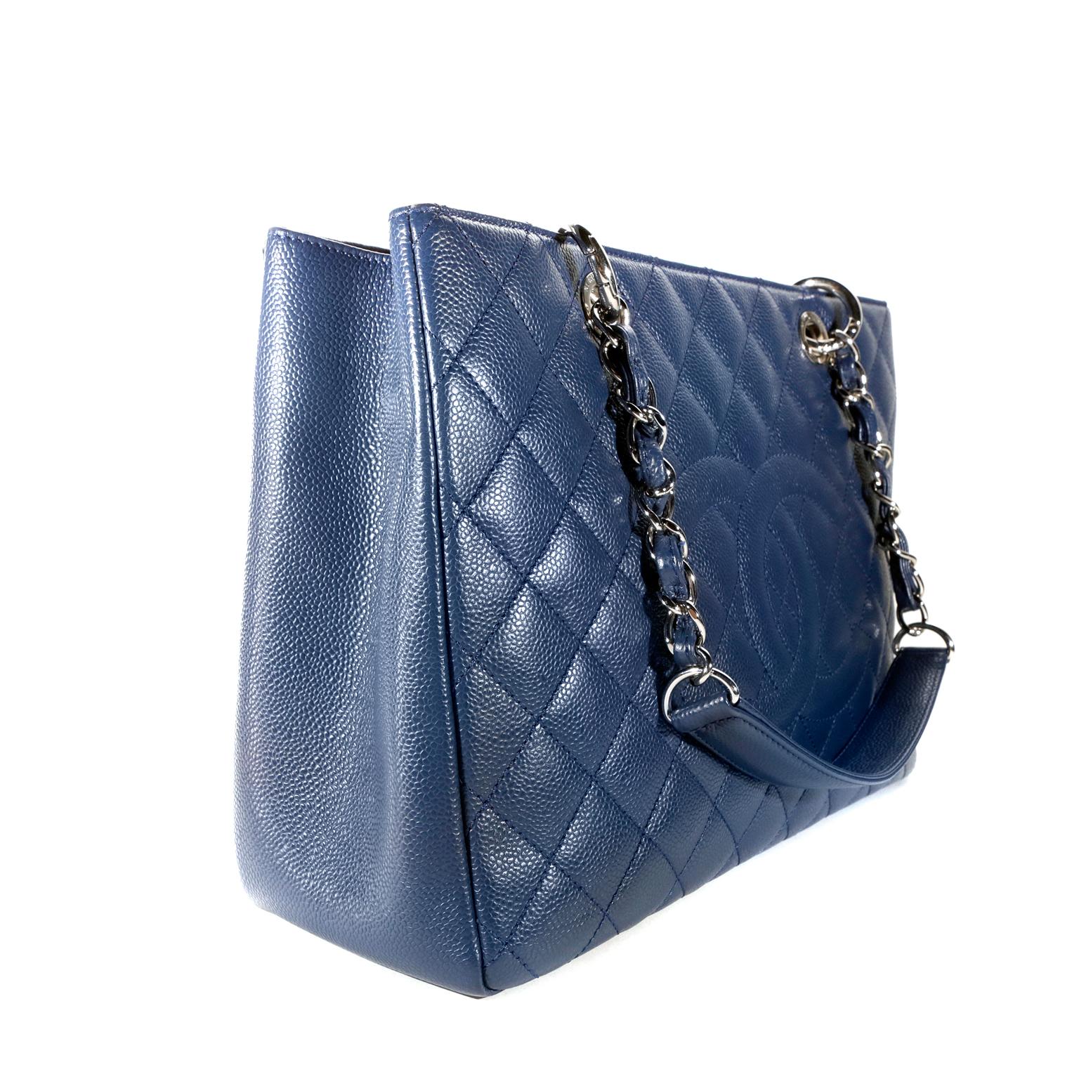Chanel Blue Caviar Grand Shopping Tote-  pristine condition
Chanel’s beloved GST is part of the timeless classics collection and is an essential piece for any sophisticated wardrobe.  
Durable dark blue caviar leather is quilted in signature Chanel