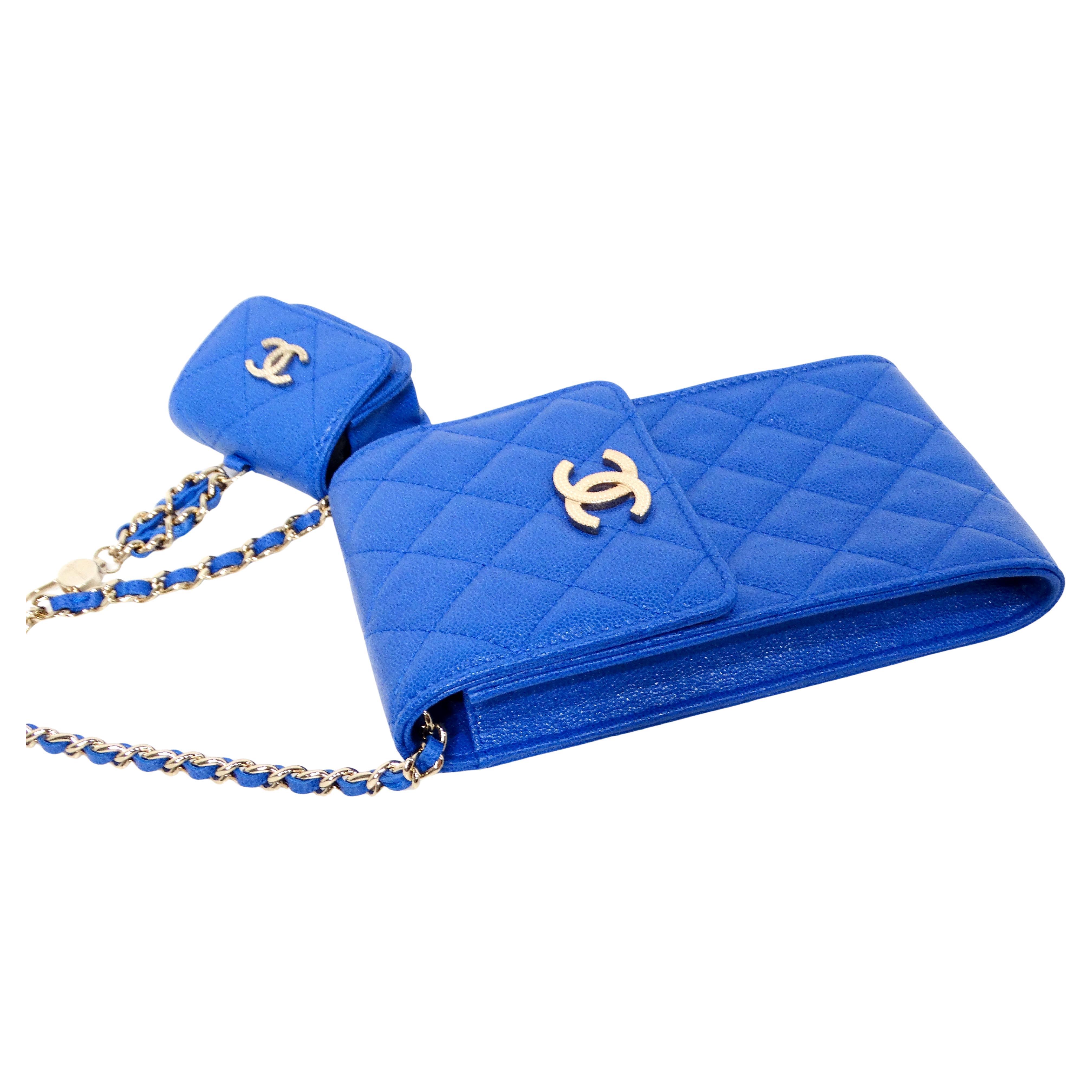 The Chanel Blue Caviar Leather Phone & AirPods Pro Case With Chain 2022 is a luxurious and versatile accessory that seamlessly combines functionality with high fashion. Crafted from blue caviar leather, it exudes elegance and durability, making it a