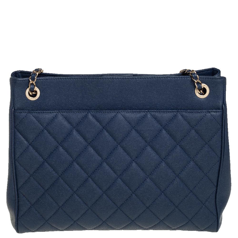 This Urban Companion tote from Chanel is quite chic and sophisticated! The bag comes crafted from Caviar leather and features the signature quilted pattern on the blue exterior. It flaunts the iconic CC in gold-tone on the front and comes equipped