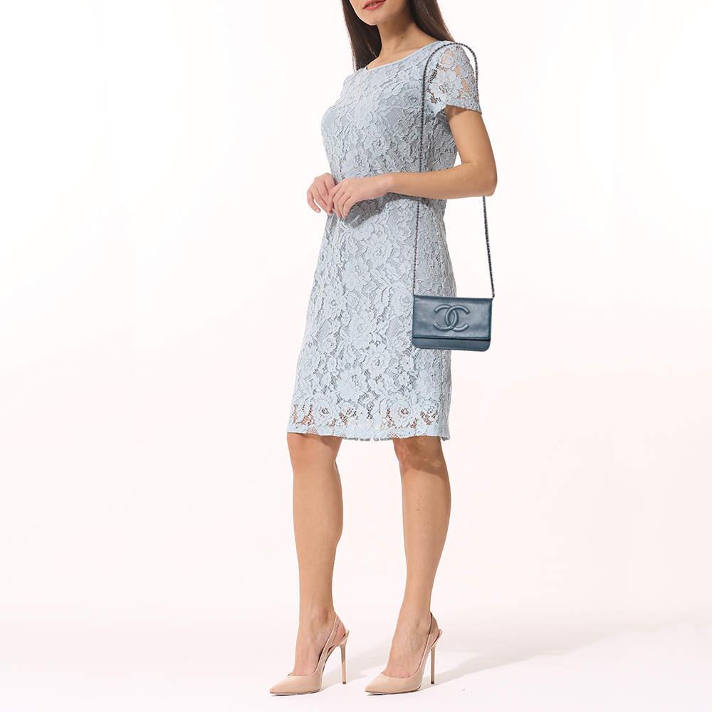 Trust this Chanel WOC to be light, durable, and comfortable to carry. Crafted from Caviar leather, it comes in a blue hue. It features a lined interior, a long strap, and the logo at the front.

