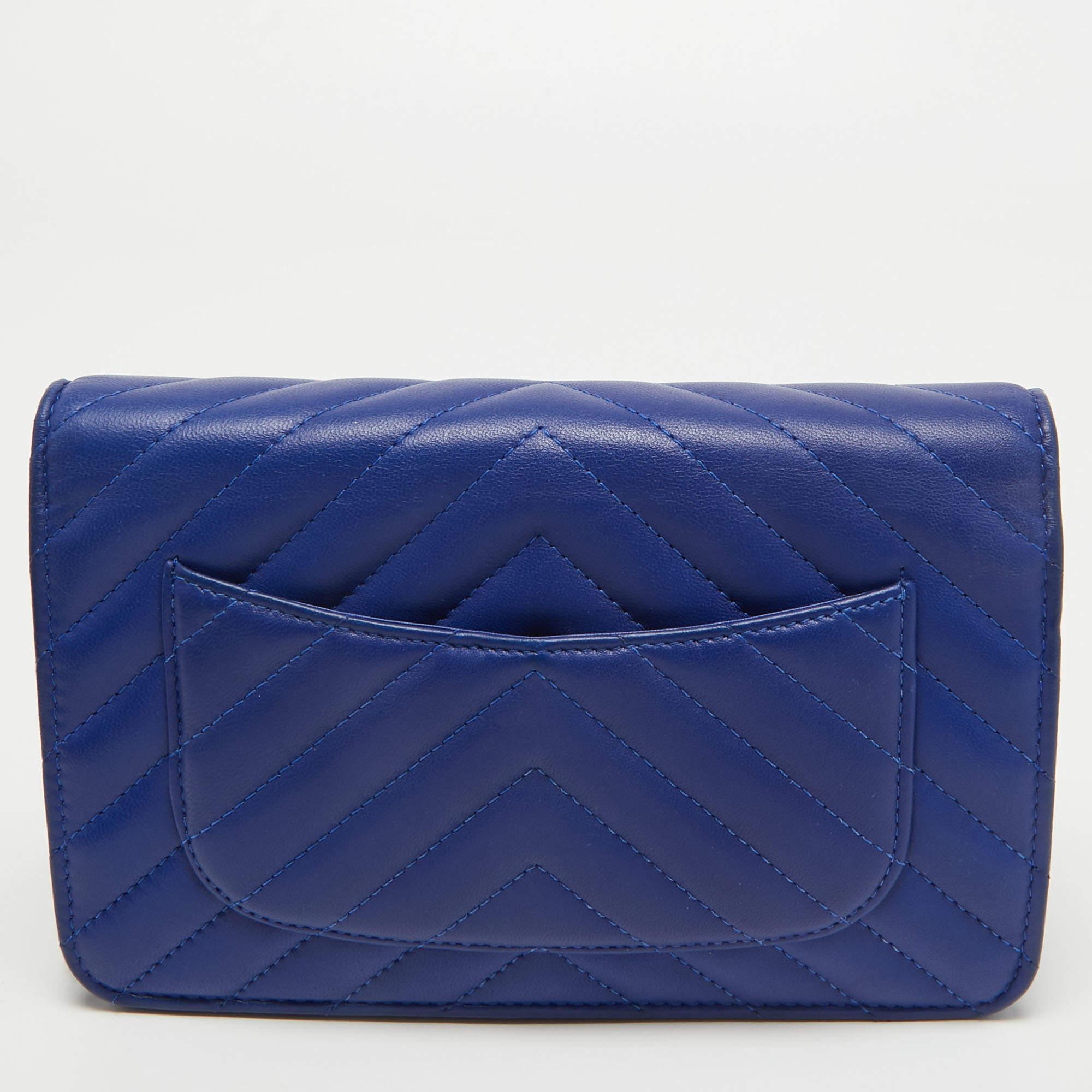 Trust this Chanel WOC to be light, durable, and comfortable to carry. Crafted from leather, it comes in a blue shade. It features a fabric interior, a long strap, and a logo at the front.

Includes: Original Dustbag

