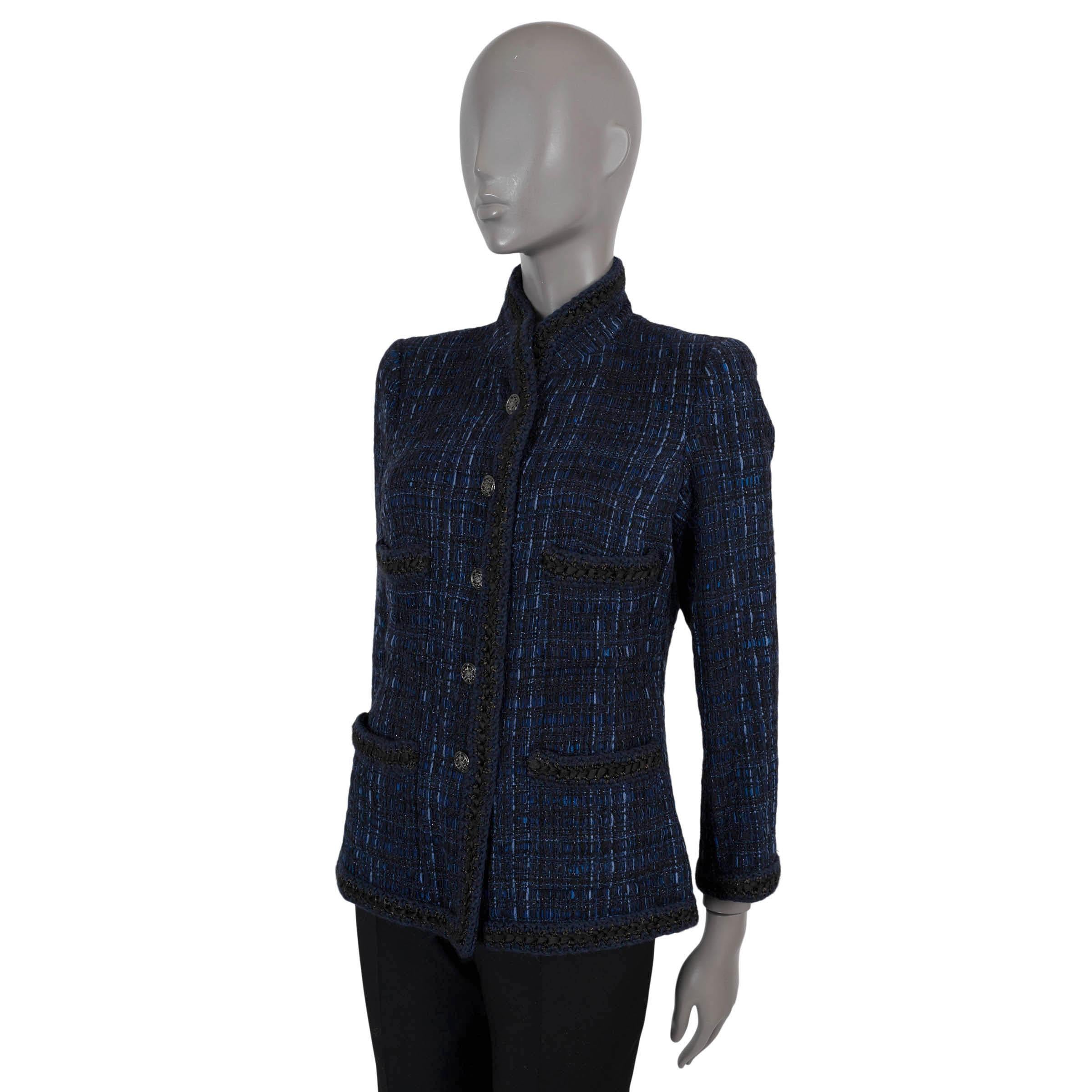 100% authentic Chanel tweed jacket in dark blue, blue and black cotton (40%), silk (25%), polyamide (15%), wool (10%), linen (10%). Features black and dark blue crochet trim, standing collar and four pockets on the front. Closes with gold-tone