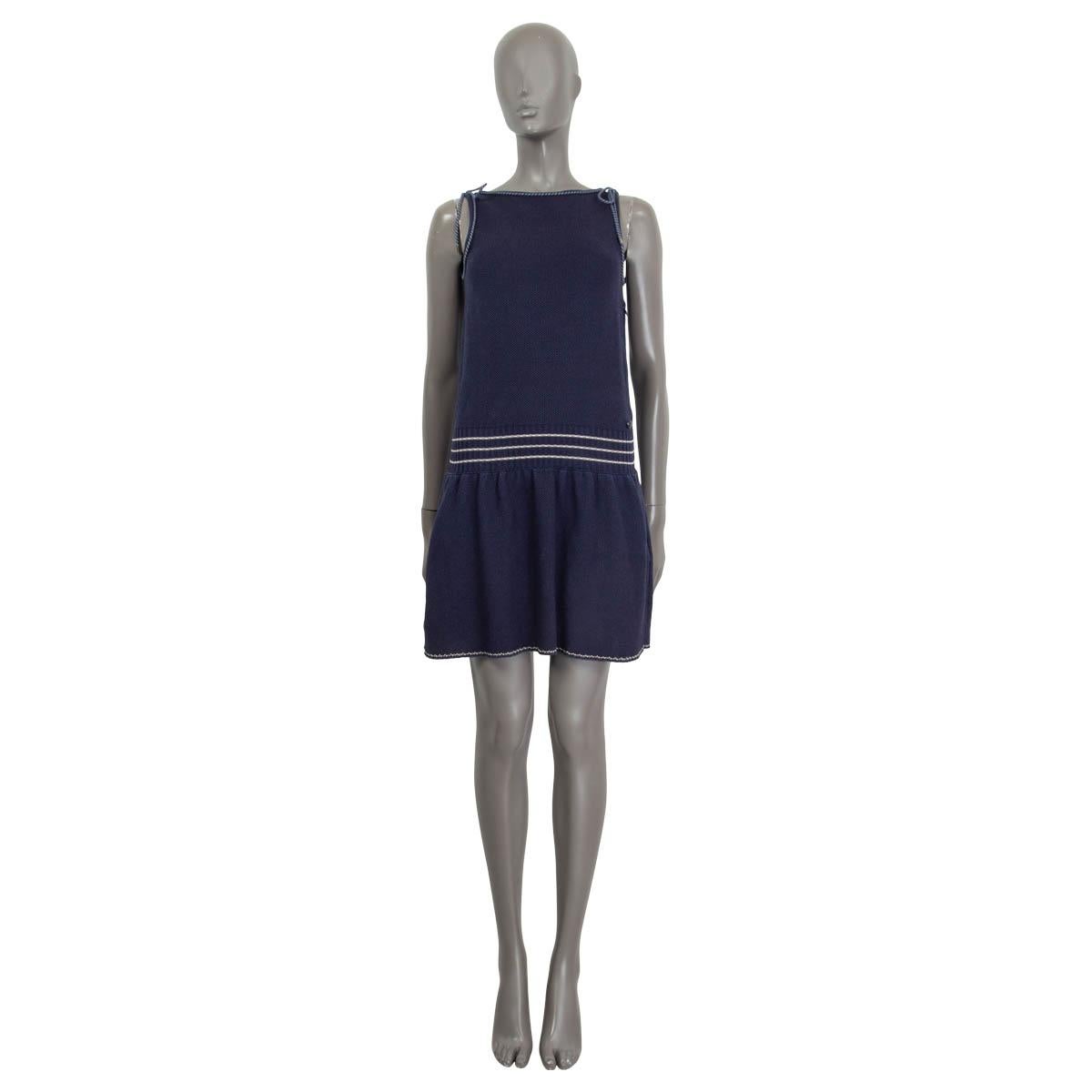 100% authentic Chanel 2015 drop waist knit dress in navy cotton (100%). Features a cord embellished trim, a 'CC' emblem at the front and a two slit pockets at the sides. Opens with a concealed zipper at the side. Unlined. Has been worn and is in