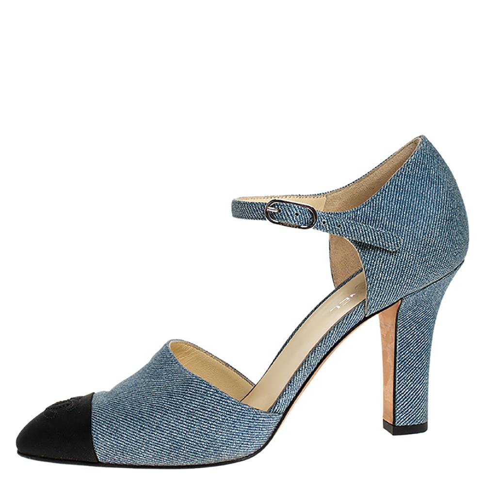 How gorgeous are these pumps from Chanel! These blue pumps are crafted from denim fabric and feature a round toe silhouette. They flaunt black canvas cap toes and block heels. Further, they come equipped with buckled ankle straps and comfortable