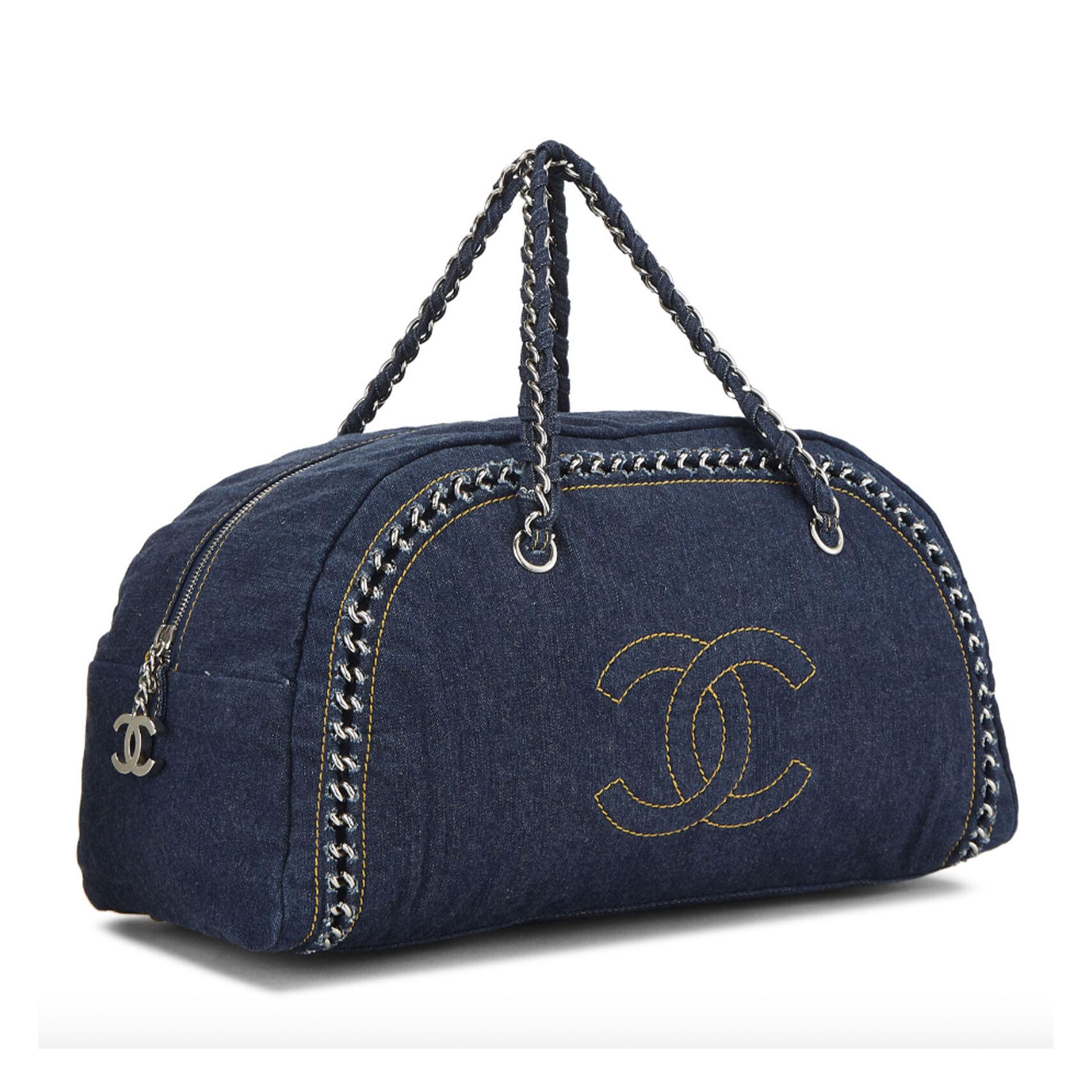 Chanel Blue Denim Bowling Bag Luxury Ligne Medium Satchel

Two Woven Chain-link And Denim Handles
Zip-around Closure
Interior Zip, Slip And Pouch Pockets
Denim
Canvas Lining
Silver Hardware

Made in Italy