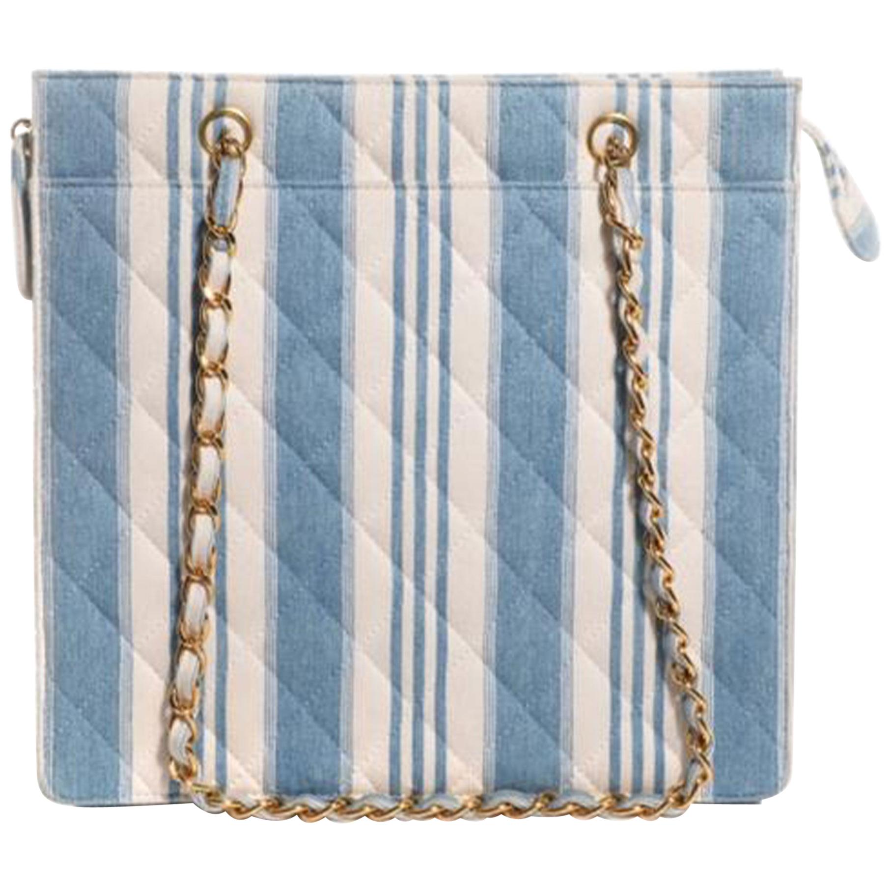 Chanel Vintage 90s Mini Striped Light Blue Denim Tote Shoulder Bag Shopping Tote

1997 {VINTAGE 27 Years}
Gold hardware
Double handle chain
Quilted jean denim striped blue and white
Zippered main compartment
Leather lined interior
Main interior