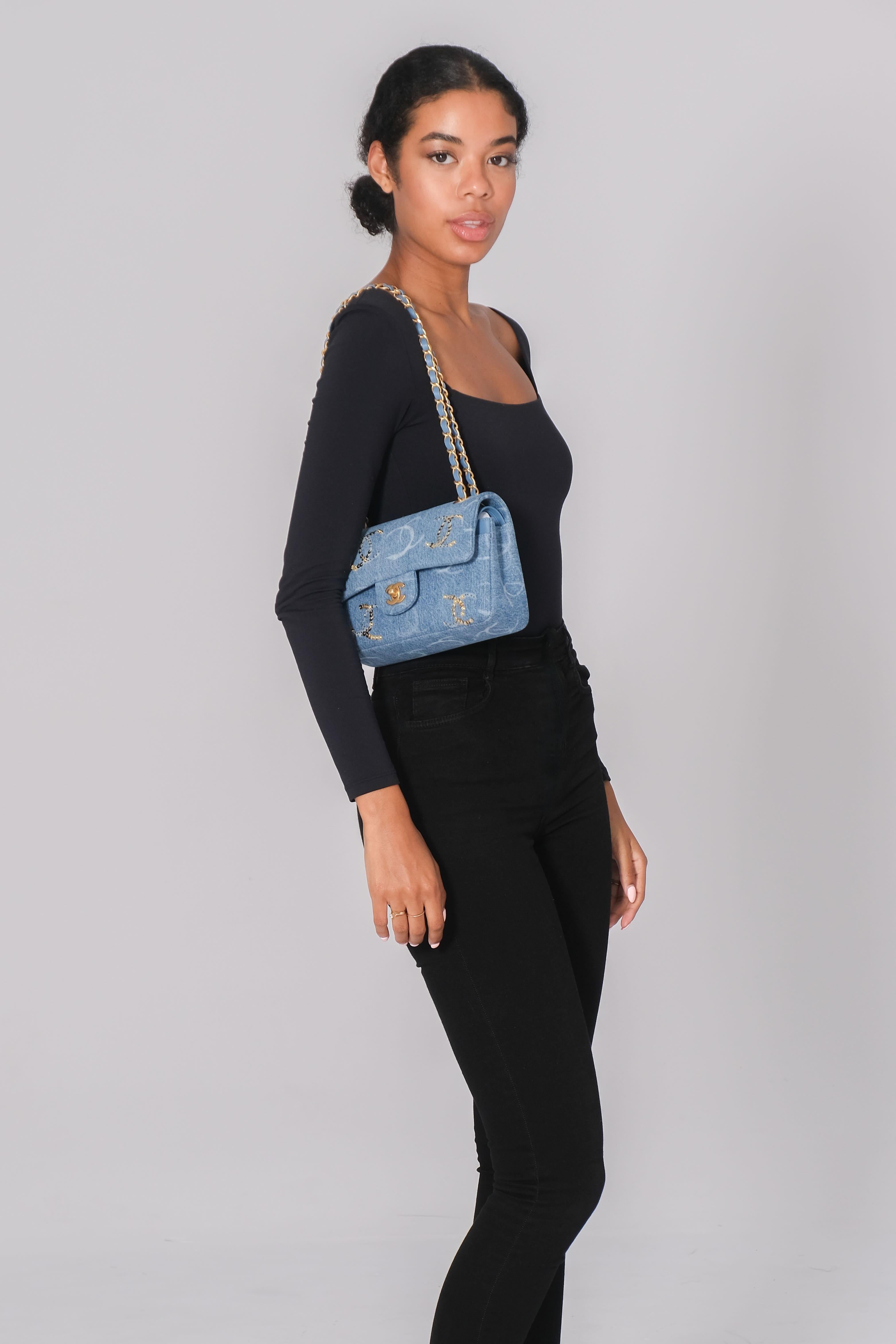 CHANEL BLUE DENIM SEQUIN CC FLAP BAG 23B MEDIUM

This Chanel rectangular flap bag is constructed of soft blue washed denim with CC logo sequin embellishments and gold tone hardware. It features a gold chain-link shoulder strap threaded with denim, a