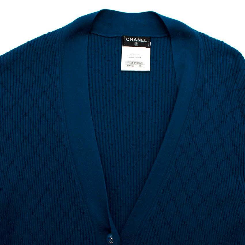 Chanel Blue Diamond Knit Longline Cardigan

-Soft, stretch lightweight cotton material
-Ribbed knit style with diamond stitching
-Gorgeous cobalt blue colour
-Blue button enclosures down front
-Iconic CC logo detailing on buttons
-Ribbed detailing