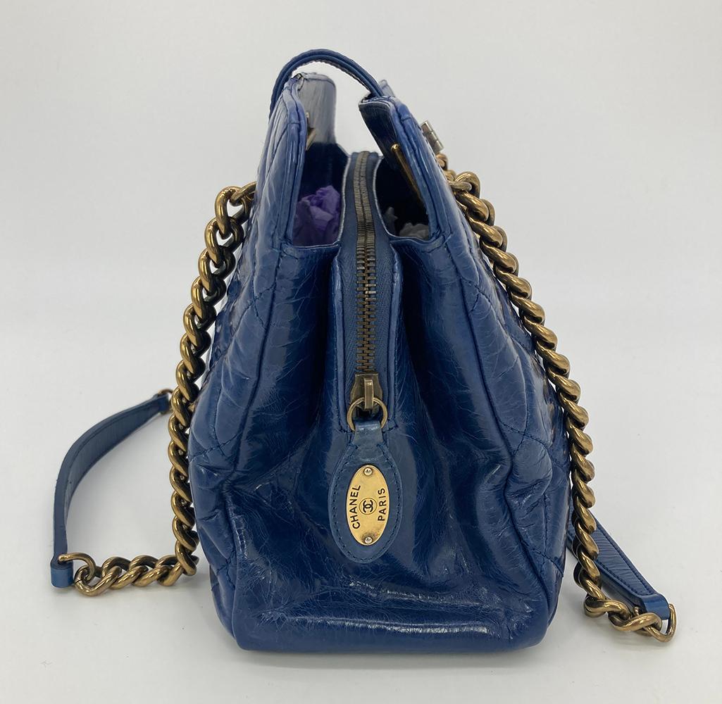 Chanel Blue Glazed Calfskin Quilted Tote Bag in very good condition. Blue glazed quilted calfskin leather trimmed with antiqued brass and silver hardware. double chain and leather shoulder straps which can be removed. Top mademoiselle twist lock