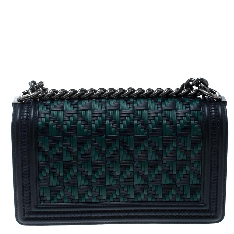 Eyed by women worldwide, Chanel's luxurious Boy Flap bag is a must-have in your closet! The stunning bag is made from blue/green leather and has a woven pattern. It features black-tone hardware and the iconic boy CC logo on the front. It has a