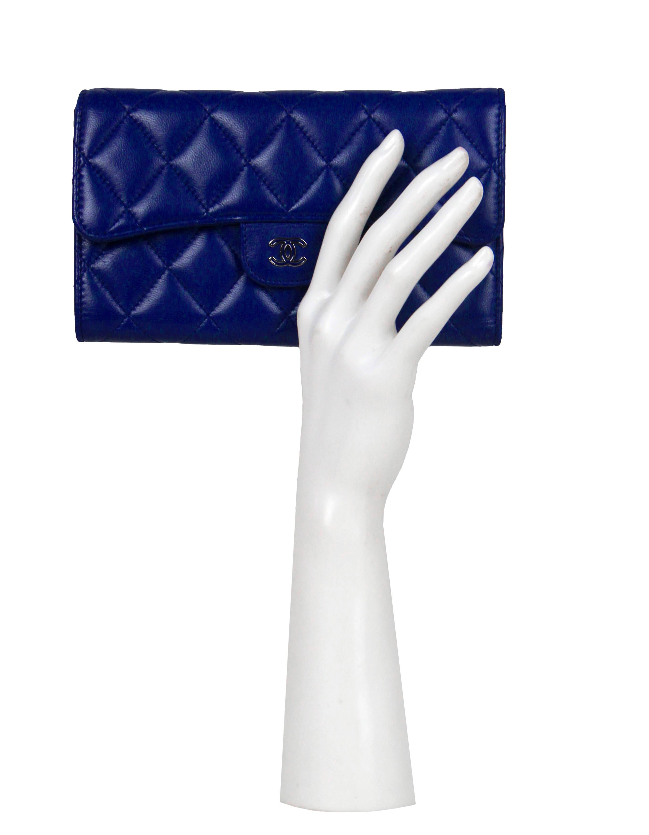 Chanel Blue Lambskin Quilted Large Gusset Flap Wallet

Made In: Spain
Year of Production: 2014-2014
Color: Blue
Hardware: Silvertone and blue enamel
Materials: Lambskin leather
Lining: Smooth leather
Closure/Opening: Flap with snap
Exterior Pockets:
