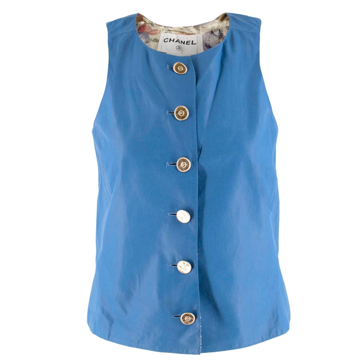 Chanel Blue Lambskin Vest

- Lightweight sky blue lambskin vest
- Silk-blend metallic floral lining
- Gold-tone coin inspired buttons with CC in the centre

Please note, these items are pre-owned and may show some signs of storage, even when unworn