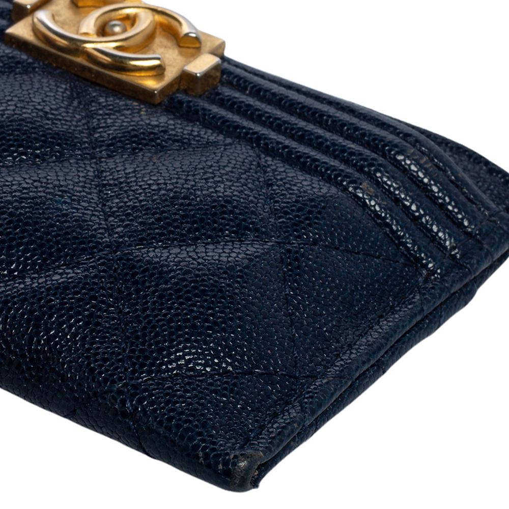 Chanel's Boy cardholder is crafted from leather and it flaunts the everlasting quilted pattern and the iconic Boy CC logo in gold-tone. It has multiple slots for carrying your important cards. This accessory will easily fit into all your bags and