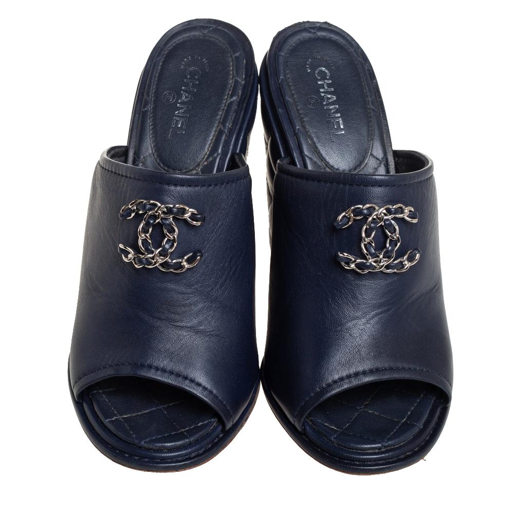 These sandals from Chanel are ideal for those days when you have to spend long hours outdoors. Crafted from leather, they feature a blue hue, broad vamp straps with gold-tone chain CC logo, and wedge heels detailed with quilting.

Includes: Original