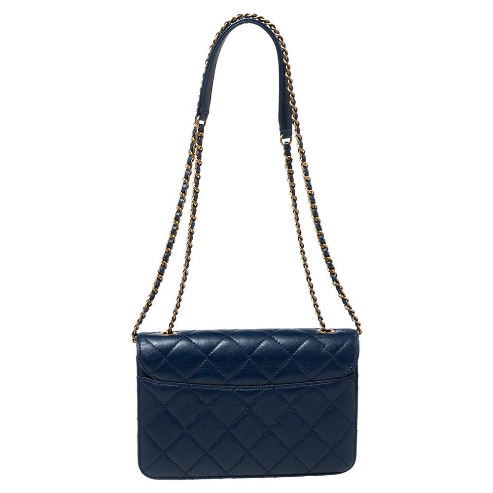 Chanel's Flap Bags are iconic and monumental in the history of fashion. This blue bag is a buy that is worth every bit of your splurge. Exquisitely crafted from leather, it bears their signature quilt pattern and a Beauty lock on the flap. The piece