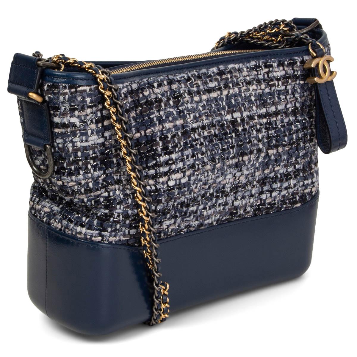 100% authentic Chanel Gabrielle Hobo bag in navy blue, light grey, grey, light blue and midnight blue bouclé tweed and navy calfskin. Double chain shoulder-strap in gold-tone, silver-tone & ruthenium-finish metal. Opens with a CC zipper on top and