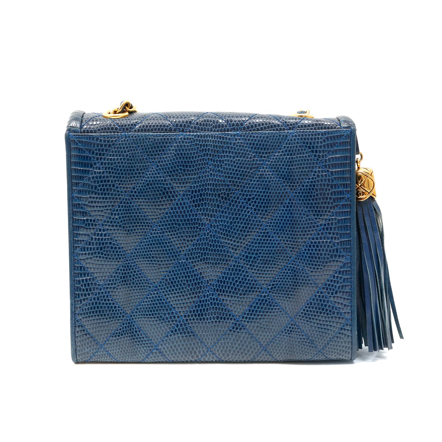 This authentic Chanel Blue Lizard Double Flap Envelope Bag is in excellent vintage condition from the late 1980's- early 1990's.  The elegant silhouette is a true classic and a great addition to any wardrobe, especially in a rare exotic.
Slim blue