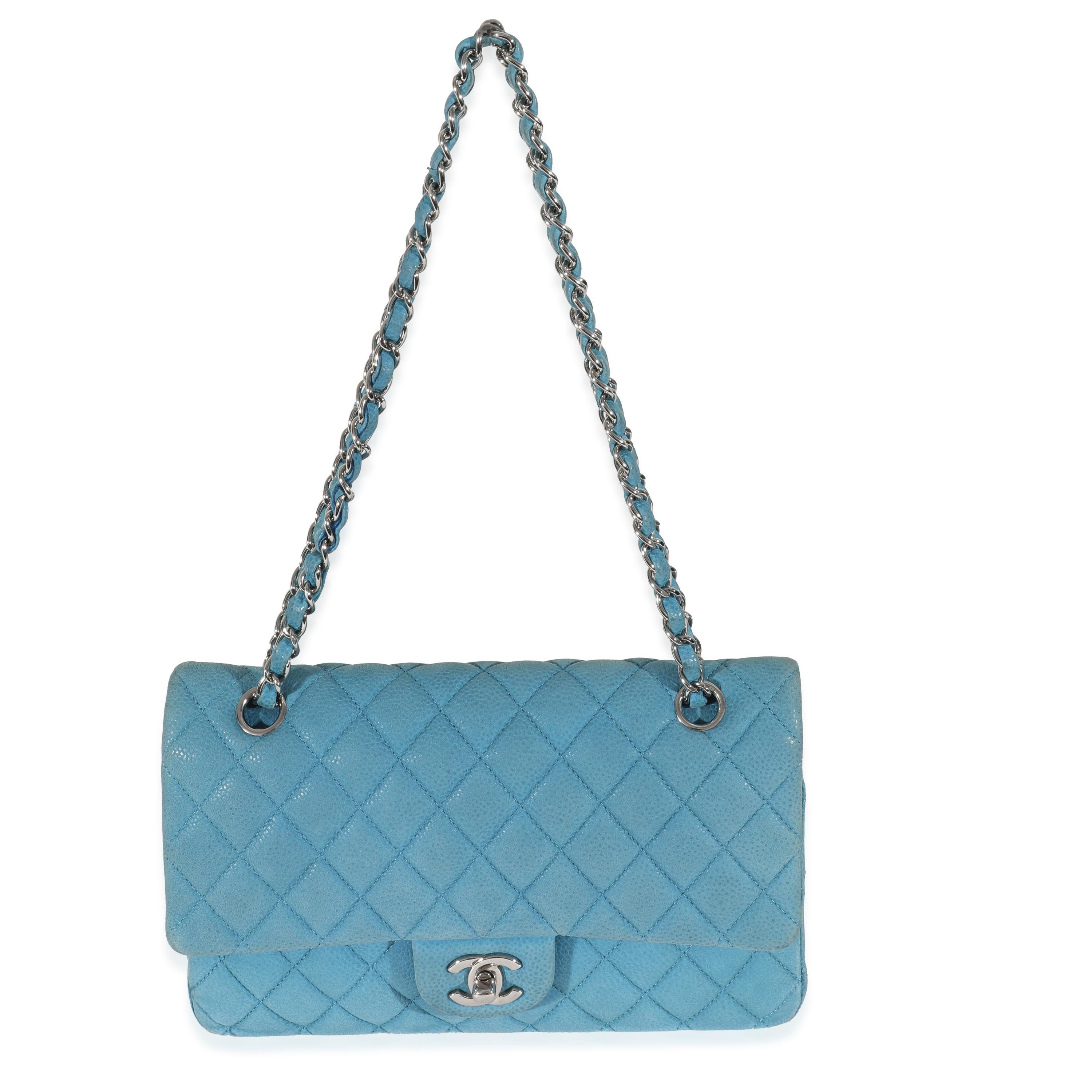 Listing Title: Chanel Blue Matte Caviar Medium Classic Double Flap Bag
SKU: 130867
Condition: Pre-owned 
Handbag Condition: Good
Condition Comments: Good Condition. Exterior corner scuffing and discoloration throughout. Scratching and tarnishing at