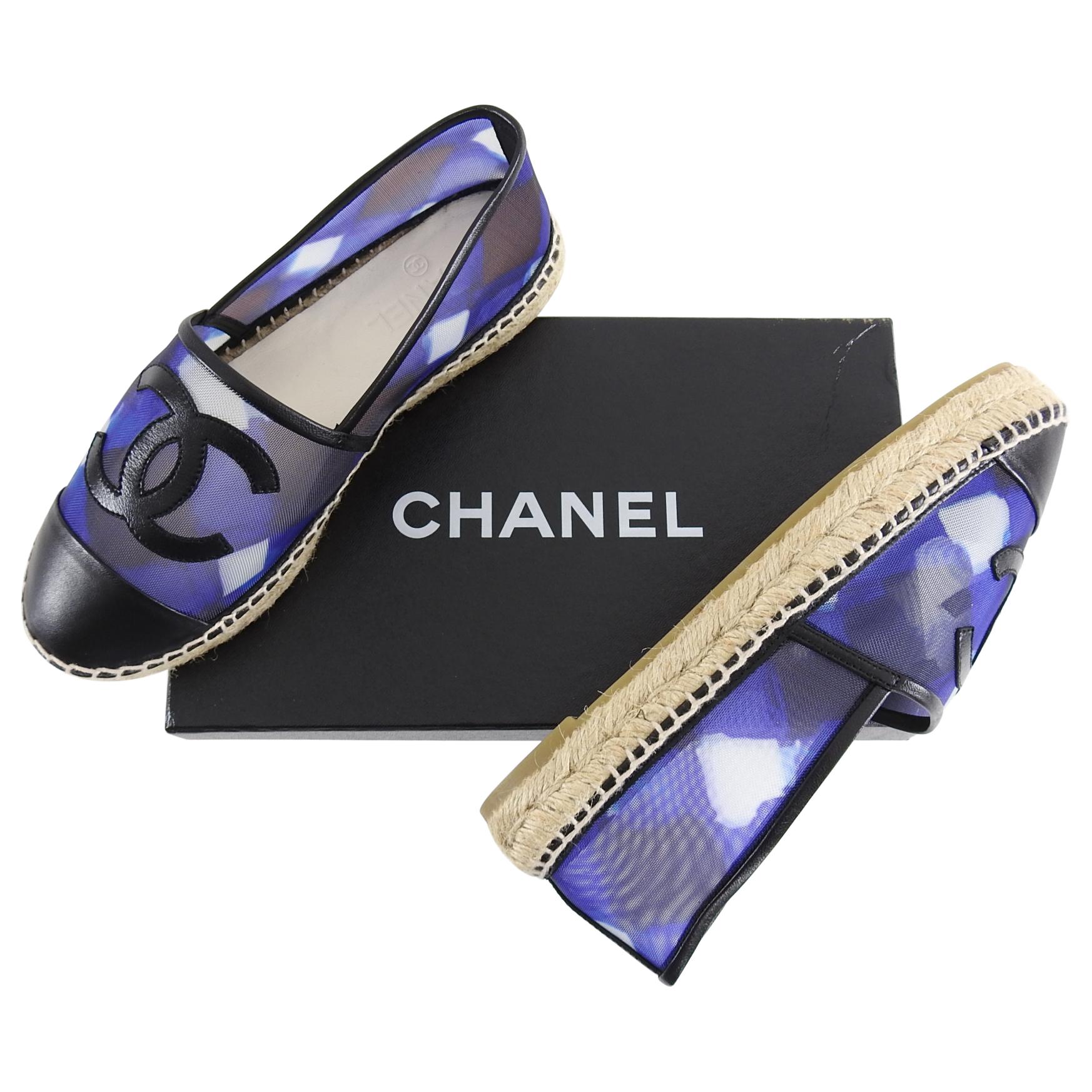 Chanel Blue Mesh and Black Leather CC Espadrille Flats.  From the 2016 collection, these sheer mesh espadrilles are trimmed with black leather.  Marked size 37 (USA 6.5 but these run small and are best for a 36.5 or USA 6). Brand new in box with