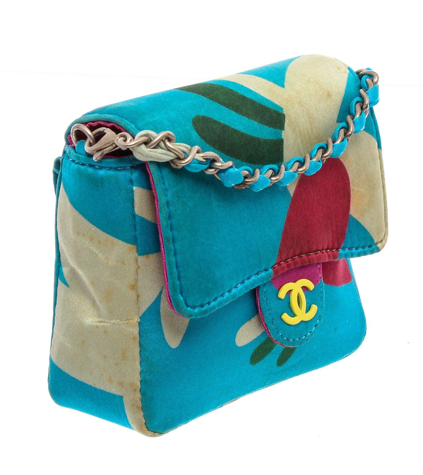 Chanel Blue Multicolor Satin Mini Messenger Pouch features a satin multicolor print with a skinny belt loop on the back and has a detachable chain strap that can be worn over your shoulder. Please note: Some staining throughout, please see