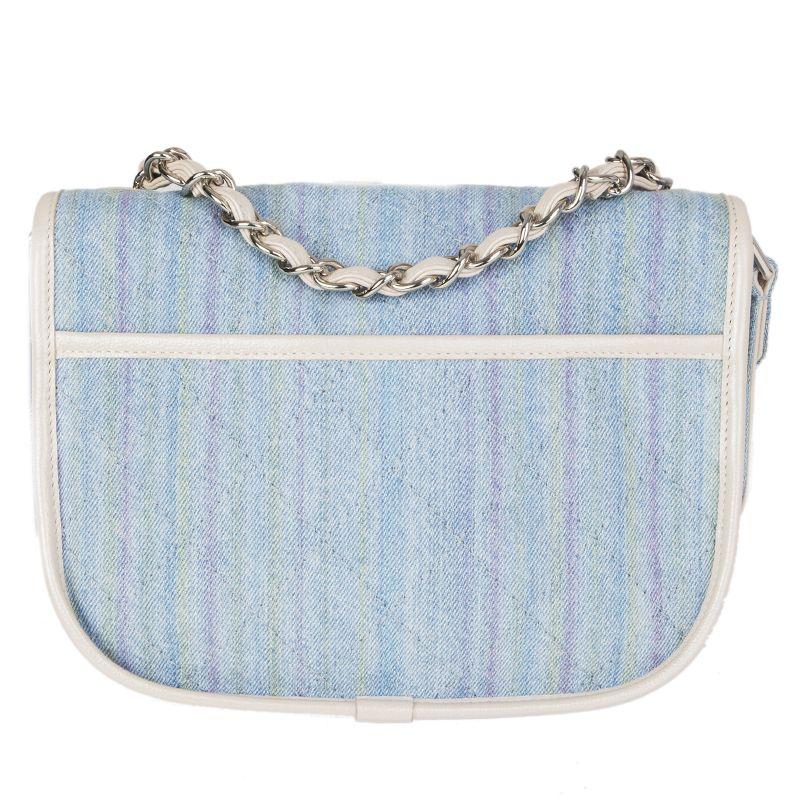 Chanel 'Small Saddle' bag in light blue, light magenta and light chartreuse striped denim with off-white leather trimming. Spring 2018 Runway bag. Opens with a CC turn lock. Open pocket under the flap. Lined in light beige canvas with two open