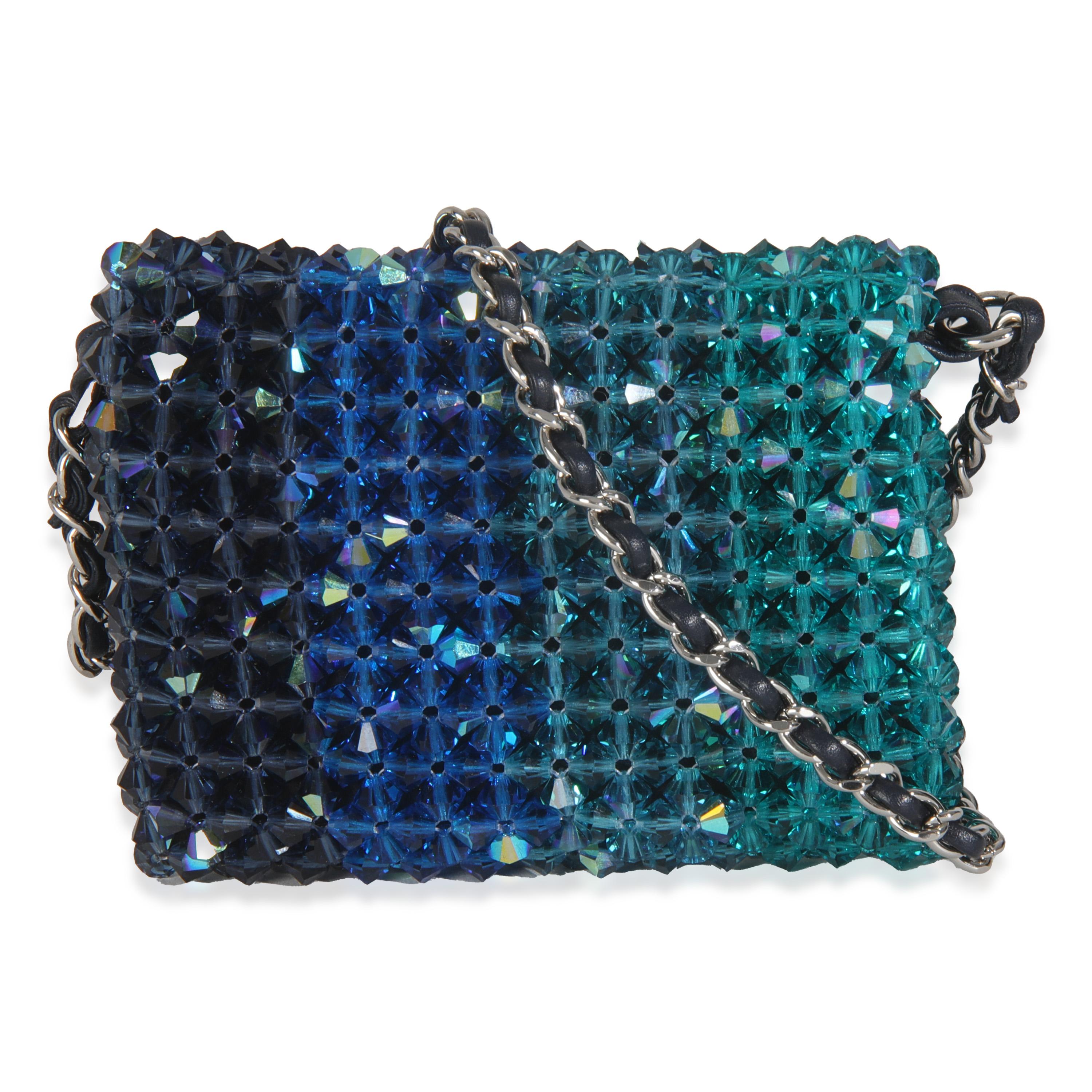 Listing Title: Chanel Blue Ombre Beaded Micro Clutch On Chain
SKU: 146049
Condition: Pre-owned 
Condition Description: A timeless classic that never goes out of style, the flap bag from Chanel dates back to 1955 and has seen a number of updates. The